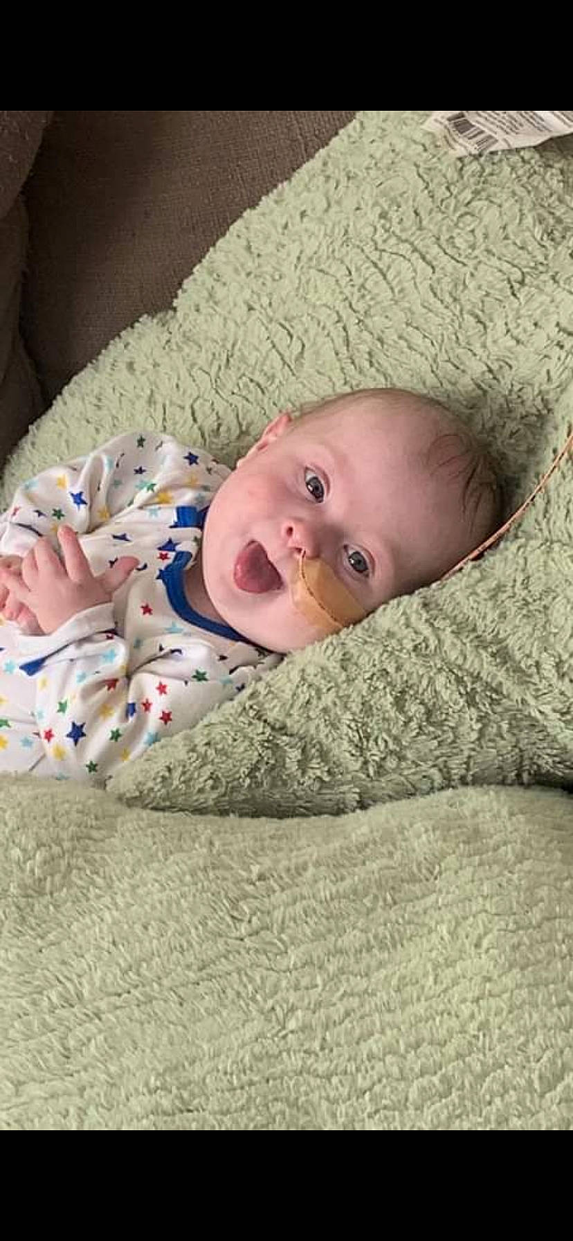 Kingston Isaiah is registered to the contest to win money with this photo: baby, baby_toddler_clothing, bedtime, cheek, child, comfort, flooring, grass, linens, mammal, nose, pattern, person, room, sitting, skin, sleep, sleeve, toddler, vertebrate