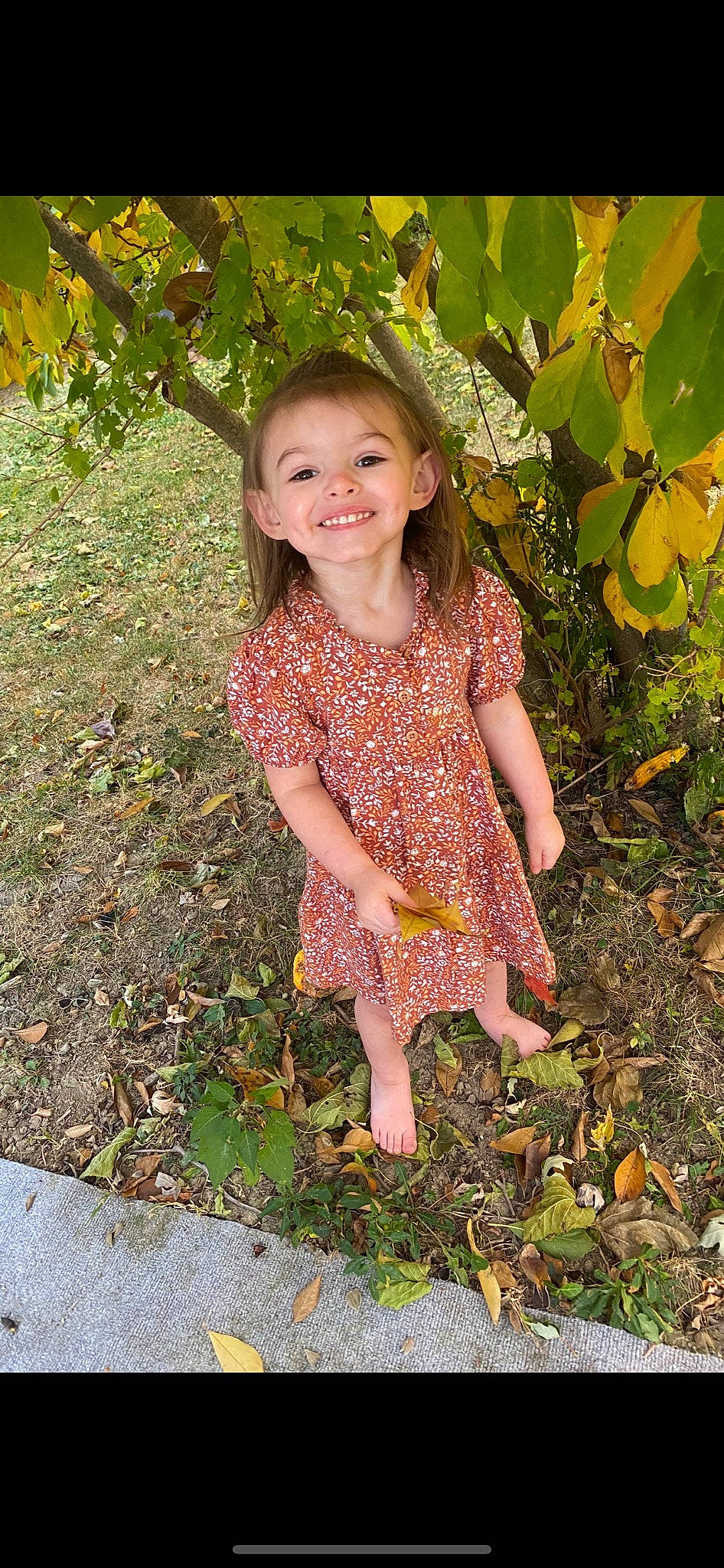 Gloria is registered to the contest to win money with this photo: baby_toddler_clothing, beauty, botany, day_dress, dress, eye, foot, grass, hair, happy, human_body, joy, leaf, pattern, people_in_nature, person, plant, smile, soil, toddler