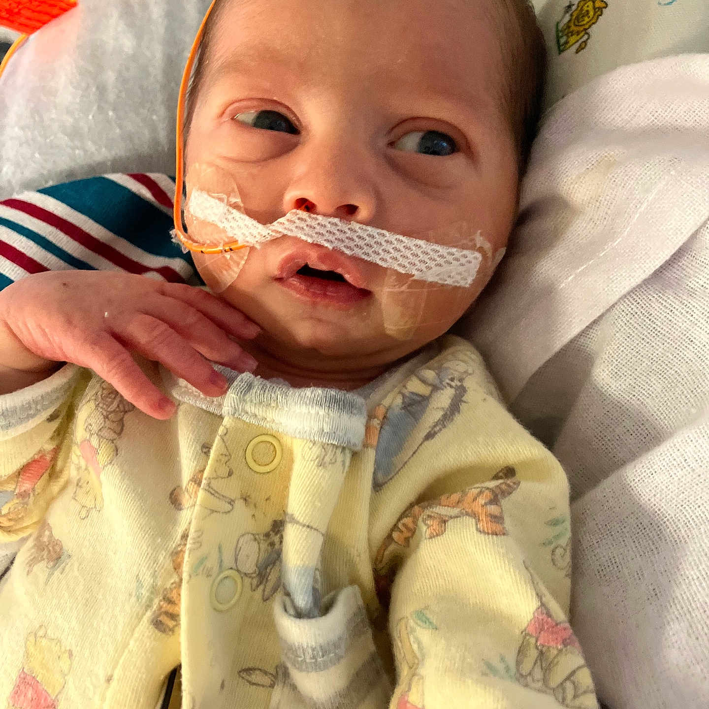 Keith is registered to the contest to win money with this photo: architecture, baby, biting, blanket, bodypart, building, face, finger, hand, happy, head, hospital, mustache, newborn, person, photography, portrait, smile, spitting