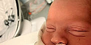 Keith is registered to the contest to win money with this photo: architecture, baby, blanket, bodypart, building, childbirth, clothing, face, finger, furniture, glove, hand, head, hospital, newborn, person, photography, portrait, sleeping, towel