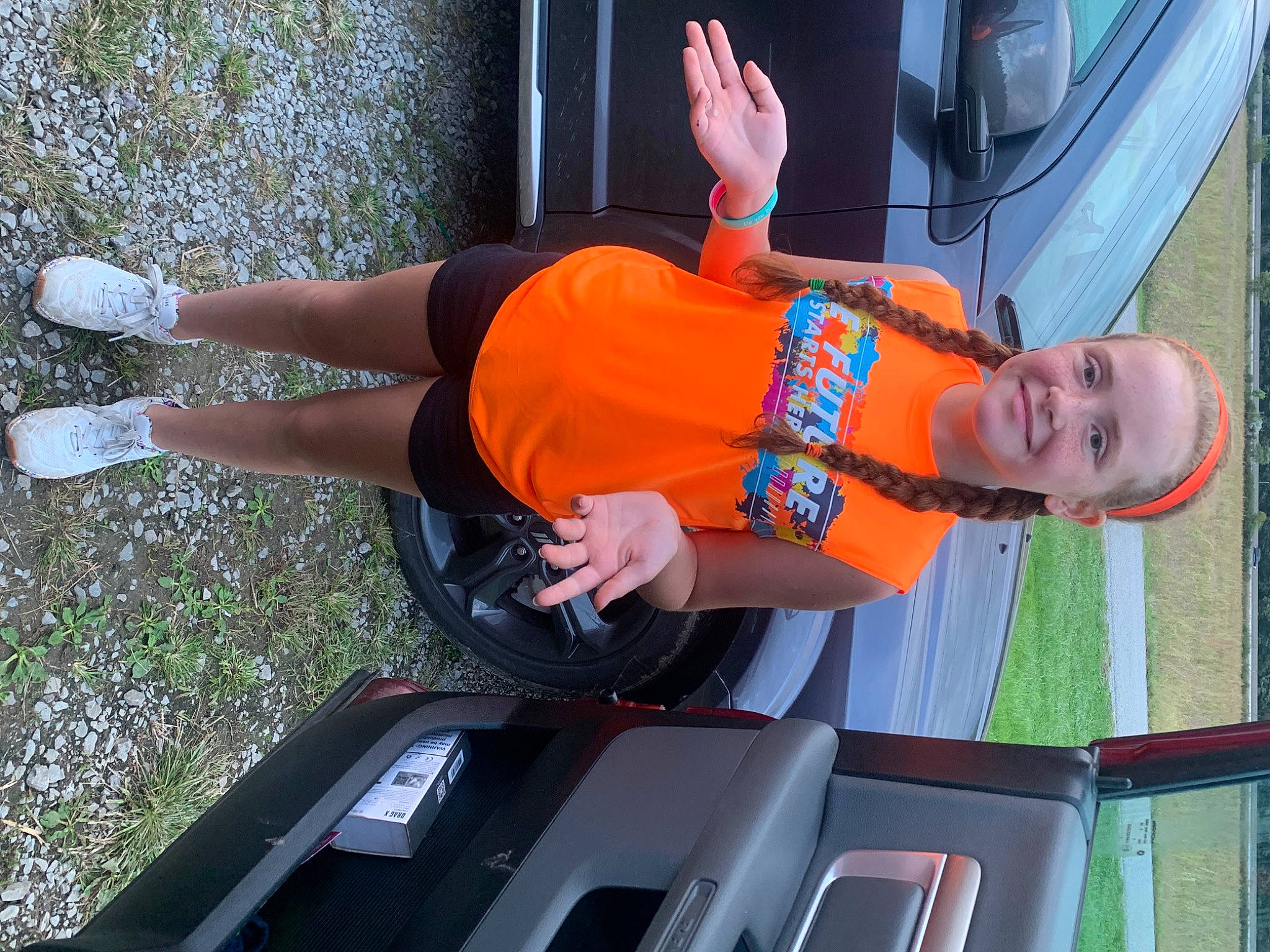 Makayla is registered to the contest to win money with this photo: auto_part, automotive_design, automotive_exterior, automotive_lighting, bumper, car, electric_blue, family_car, hat, human_leg, joy, motor_vehicle, person, recreation, shorts, thigh, tire, trunk, vehicle, vehicle_door