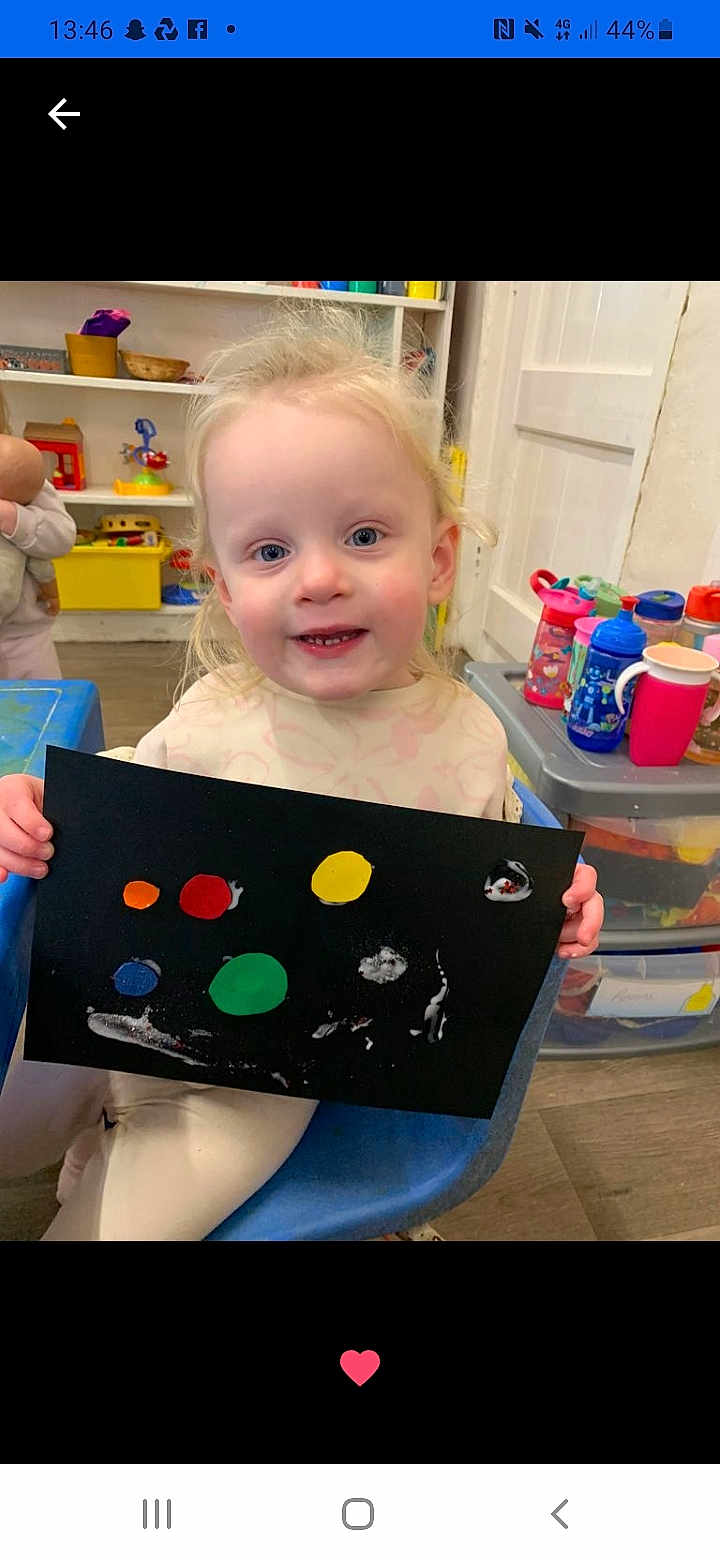 Ada-Rose joined the competition — help win amazing prizes! toddler, child, painting, art, colorful, black_paper, blue_chair, classroom, toys, cups, plastic_containers, smiling, happy, indoor, playroom, blonde_hair, person, creative, young_child, holding