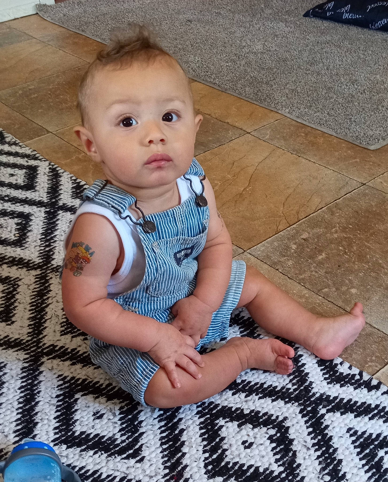 Khaza joined the competition — help win amazing prizes! baby, baby_toddler_clothing, blue, cheek, child, concrete, day_dress, electric_blue, flooring, foot, iris, pattern, person, road_surface, sitting, skin, sleeve, surprise, toddler, water_bottle