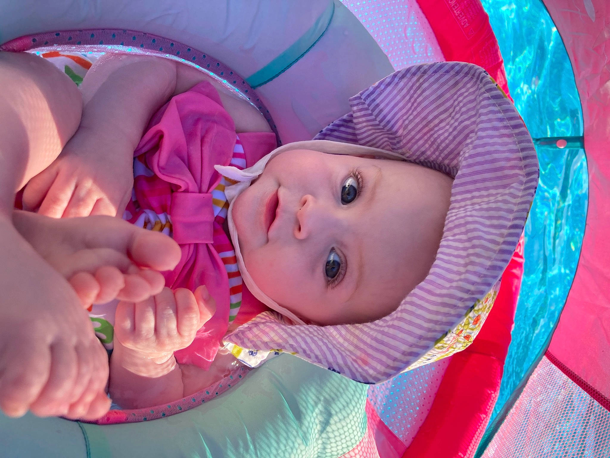 Riley joined the competition — help win amazing prizes! baby, baby_toddler_clothing, cap, cheek, child, facial_expression, fun, gesture, happy, headgear, headwear, human_body, lip, magenta, mouth, nose, person, pink, purple, skin