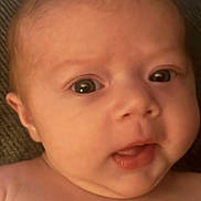 Isabel is registered to the contest to win money with this photo: baby, infant, face, skin, expression, eyes, mouth, head, portrait, closeup, curious, newborn, child, human, soft, warm, indoor, person, cute, young