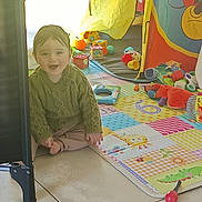 Noëlan participe au concours pour gagner de l'argent avec cette photo : baby, child, smiling, indoor, playmat, toy, tent, colorful, sweater, floor, tile, happy, infant, crawling, person, play, cute, bright, fun, young