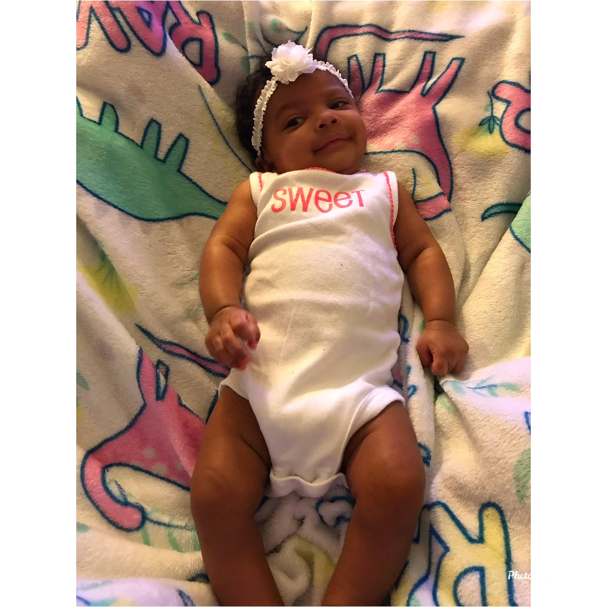 Alorah is registered to the contest to win money with this photo: baby, child, headwear, joy, linens, person, toddler