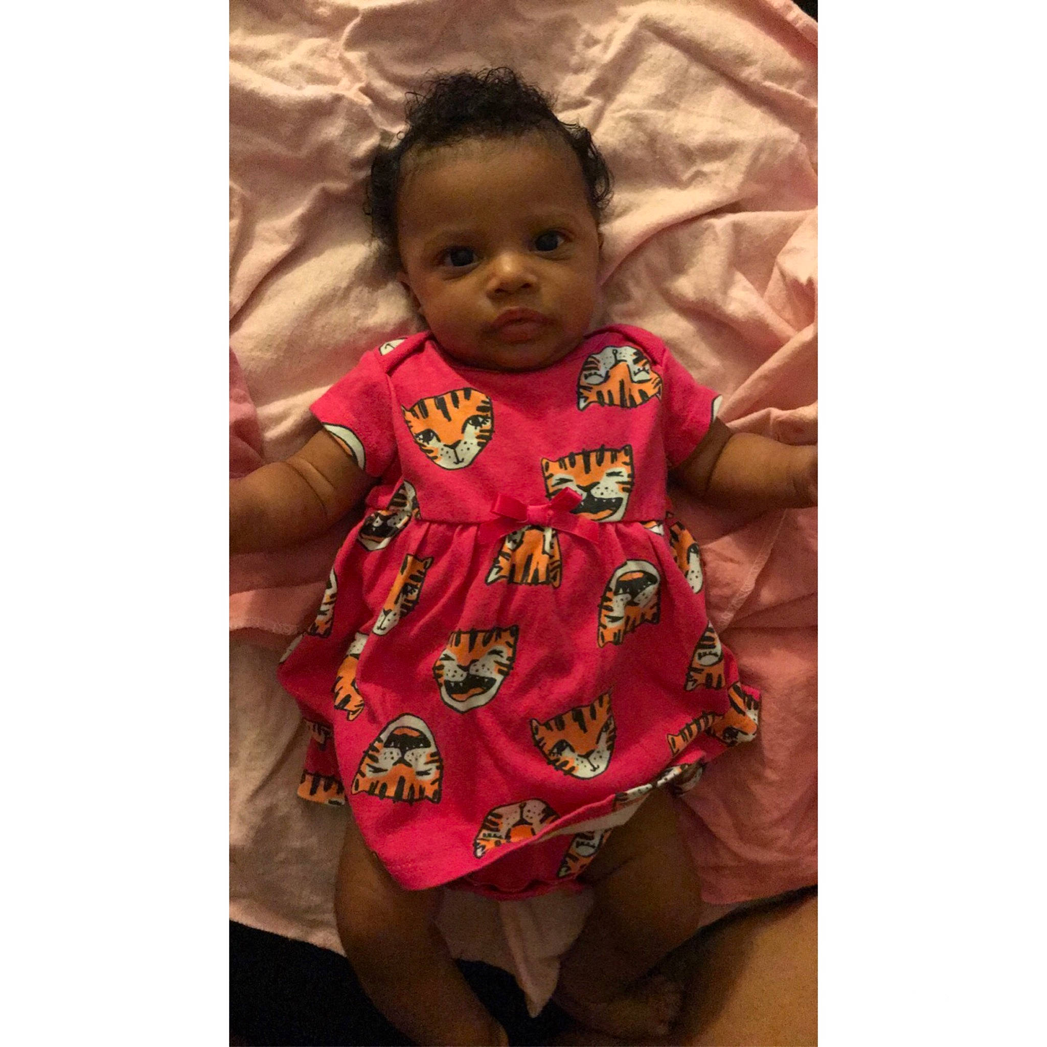 Alorah is registered to the contest to win money with this photo: baby, cheek, child, dress, face, head, pattern, person, pink, play, sleeve, smile, toddler