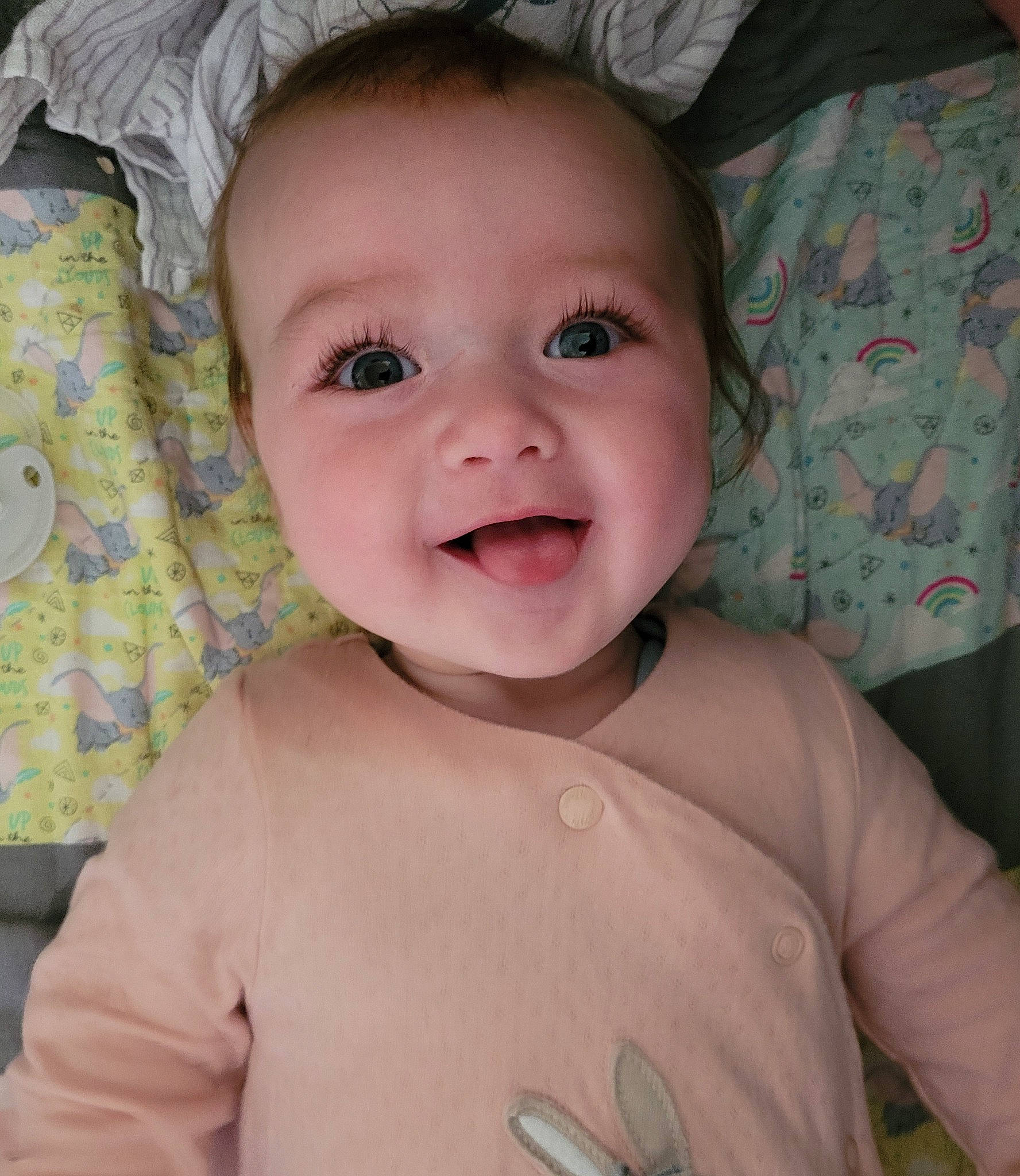 Kayce is registered to the contest to win money with this photo: baby, baby_toddler_clothing, cheek, chest, eye, eyelash, finger, gesture, happy, head, human_body, iris, lip, mouth, nose, person, pink, skin, smile, toddler