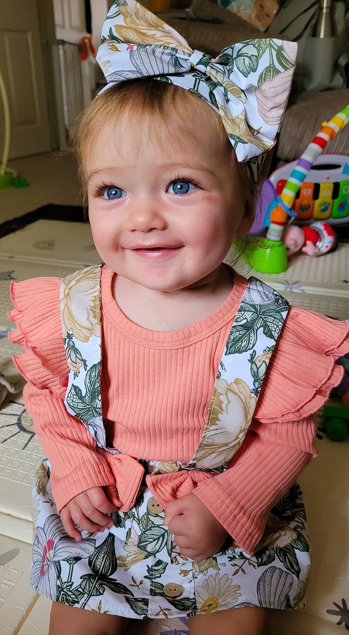 Kayce joined the competition — help win amazing prizes! baby, baby_toddler_clothing, cap, cheek, child, costume_hat, dress, eye, face, happy, headpiece, iris, jewellery, joy, pattern, person, pink, skin, sleeve, smile