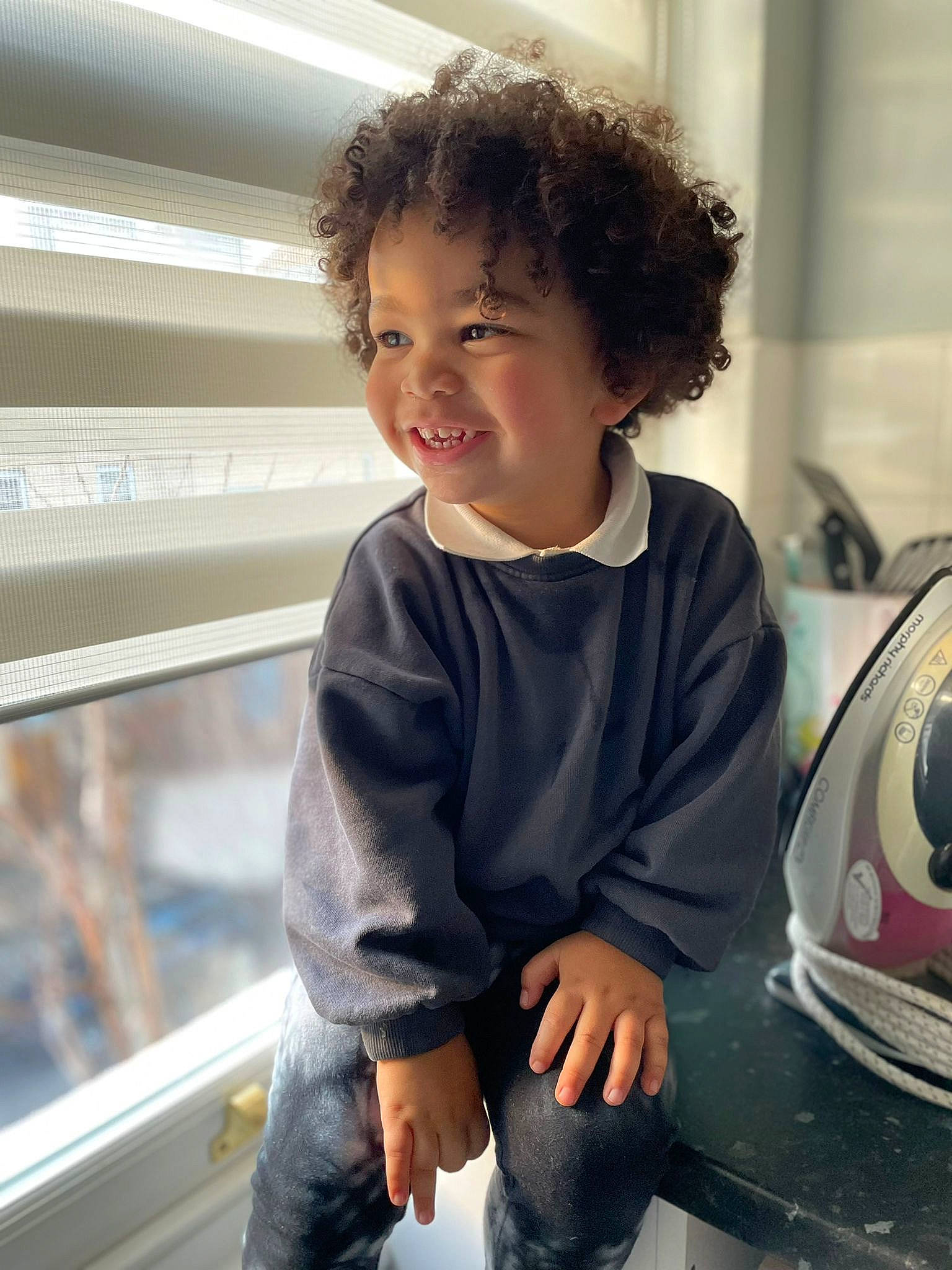 Ezra joined the competition — help win amazing prizes! automotive_lighting, baby, baby_toddler_clothing, child, facial_expression, family_car, flooring, fun, happy, joy, motor_vehicle, person, personal_protective_equipment, room, sitting, sleeve, smile, snapshot, t_shirt, toddler