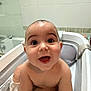 baby, bathtub, bath, water, bubbles, child, smile, happy, cute, skin, indoor, tiled_wall, head, face, person, plump, joyful, bathroom, sitting, wet