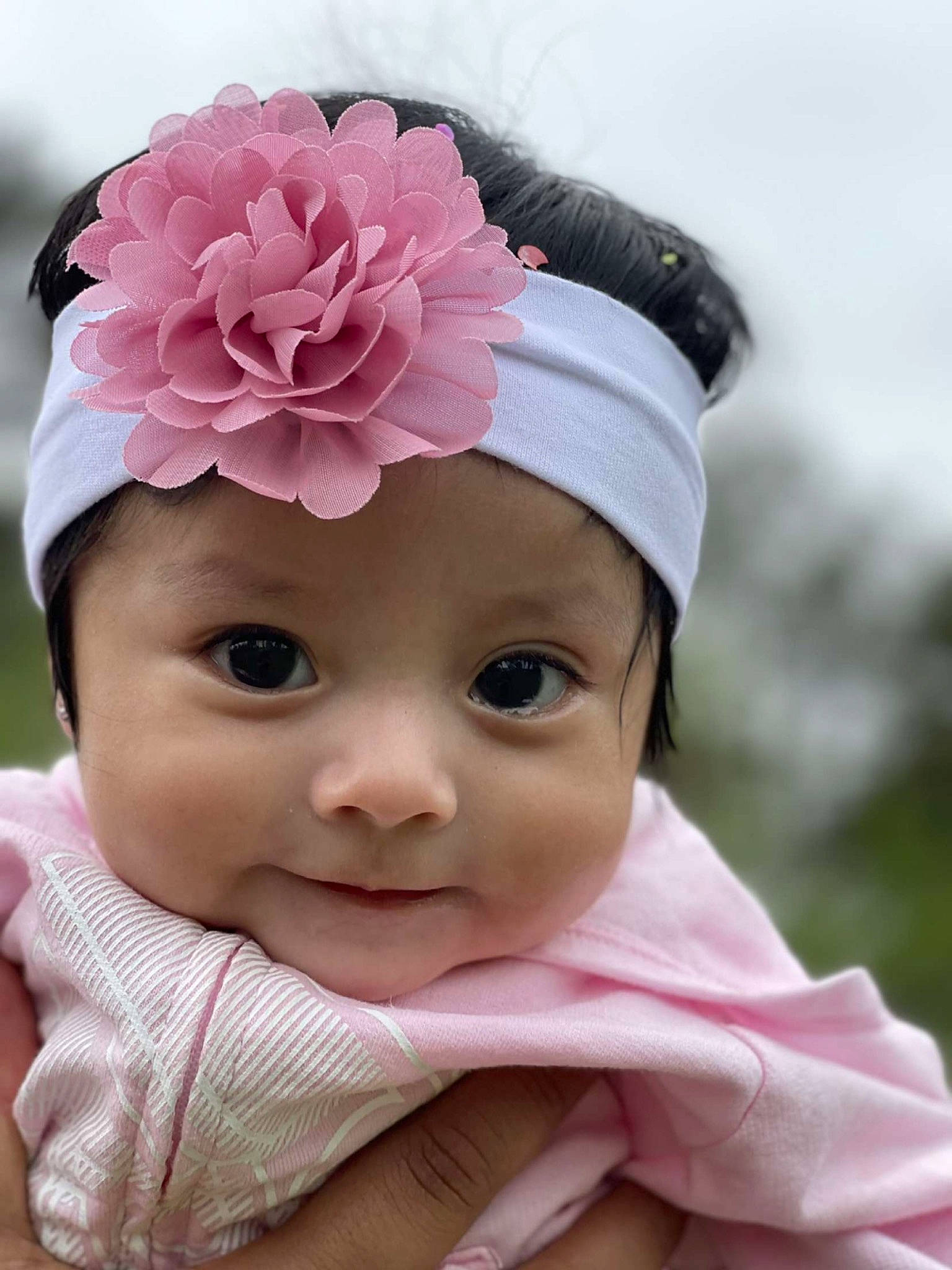 Ariana joined the competition — help win amazing prizes! baby, baby_toddler_clothing, cap, cheek, child, eyebrow, fashion_accessory, flower, hair_accessory, happy, headband, headgear, headpiece, headwear, lip, magenta, person, petal, pink, skin