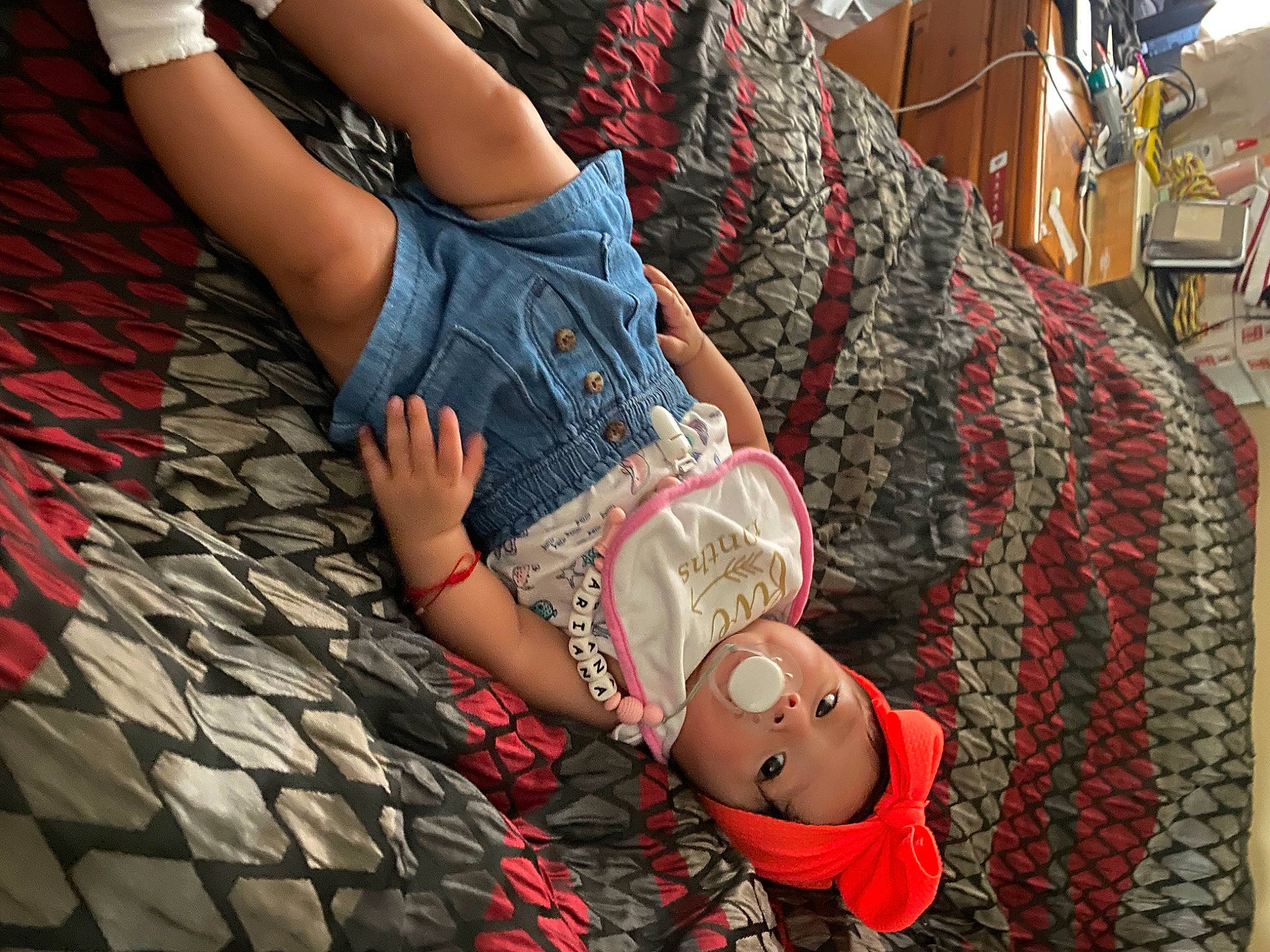 Ariana is registered to the contest to win money with this photo: abdomen, black_hair, denim, dress, elbow, fashion_design, gesture, headwear, knee, leg, nail, person, plaid, shorts, sleeve, street_fashion, tartan, textile, thigh, trunk