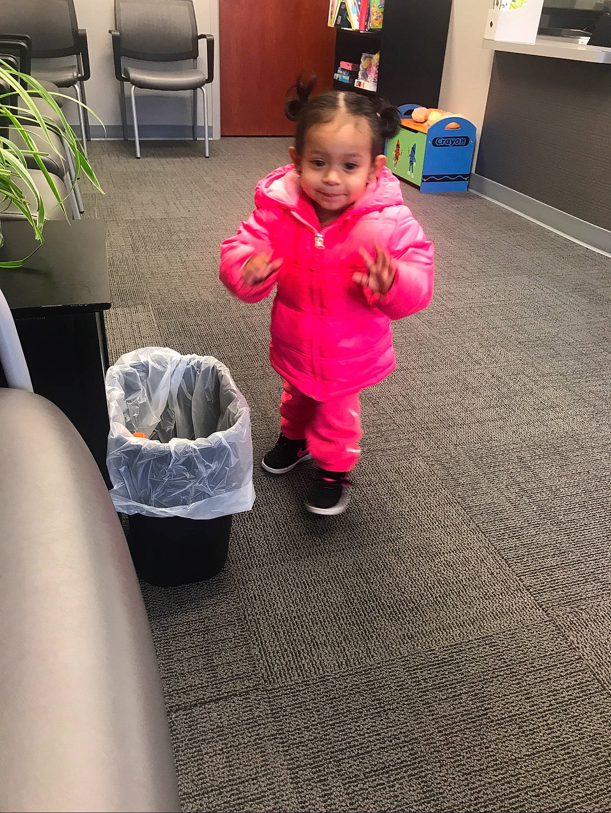 Genesis Maria is registered to the contest to win money with this photo: baby, child, electronic_device, floor, flooring, fun, joy, leg, outerwear, person, play, sitting, standing, technology, toddler