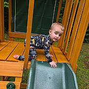 Sawyer joined the competition — help win amazing prizes! toddler, child, playground, slide, wood, pajamas, dinosaur, outdoor, greenery, climbing, hand, foot, face, expression, play, daylight, nature, structure, abc, crawling