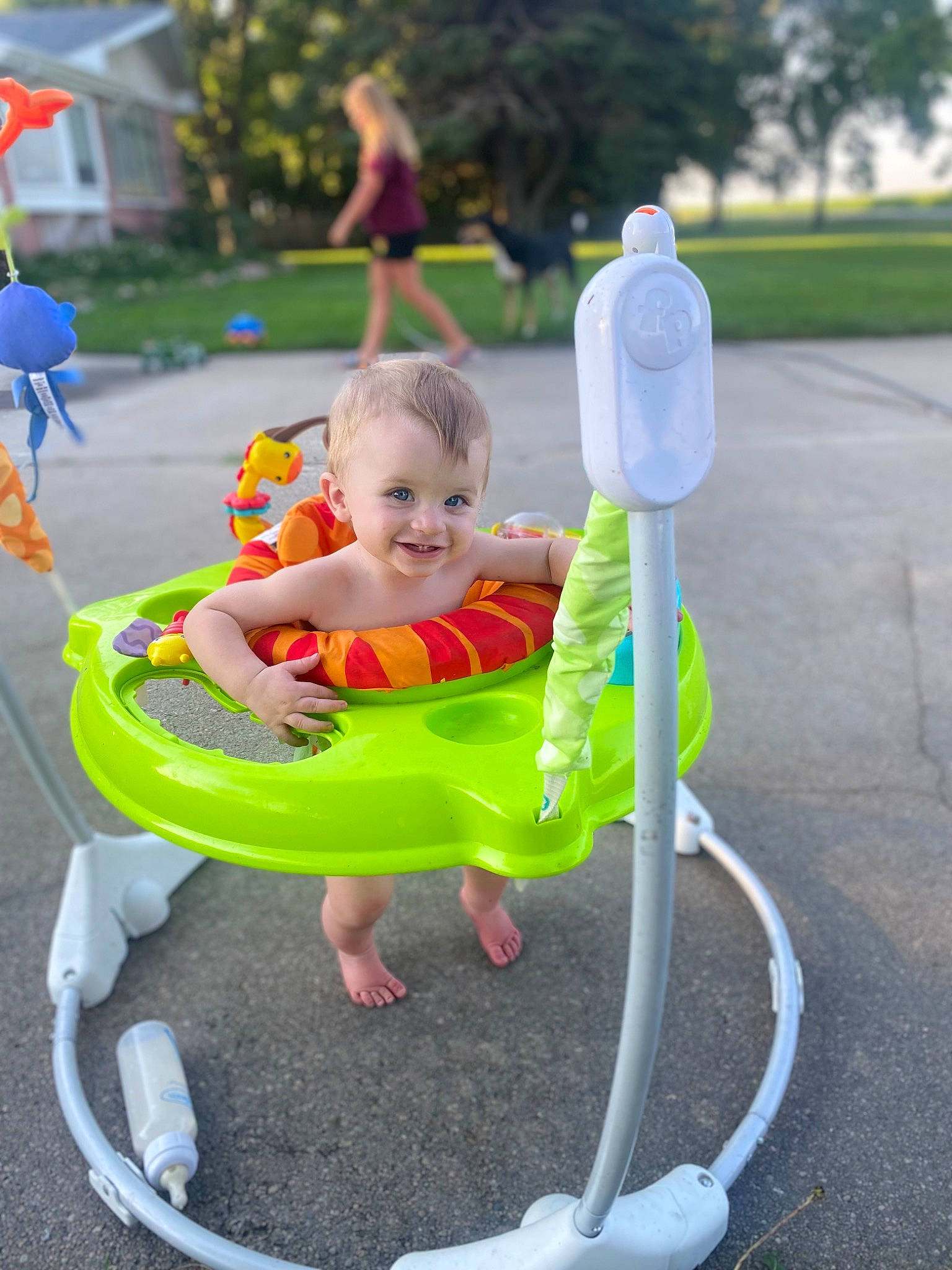 Donald is registered to the contest to win money with this photo: baby, baby_toddler_clothing, child, city, facial_expression, fun, grass, happy, joy, leisure, outdoor_furniture, outdoor_play_equipment, person, photograph, play, public_space, recreation, sitting, smile, toddler