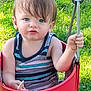 toddler, child, swing, outdoor, grass, blue_eyes, tank_top, striped_clothing, summer, playground, baby, holding, pacifier, hand, face, expression, sunlight, nature, fun, play