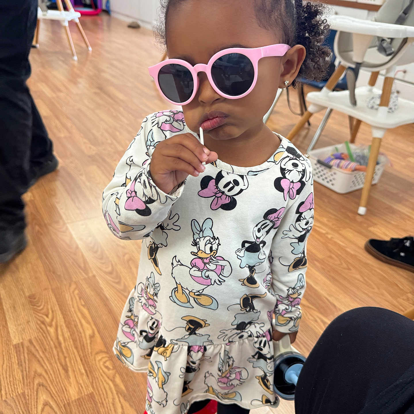 Riley joined the competition — help win amazing prizes! black_tights, child, confident, curly_hair, cute, disney, dress, earrings, fashion, footwear, hair, indoor, lollipop, person, playful, red_shoes, sunglasses, toddler, toy, wooden_floor