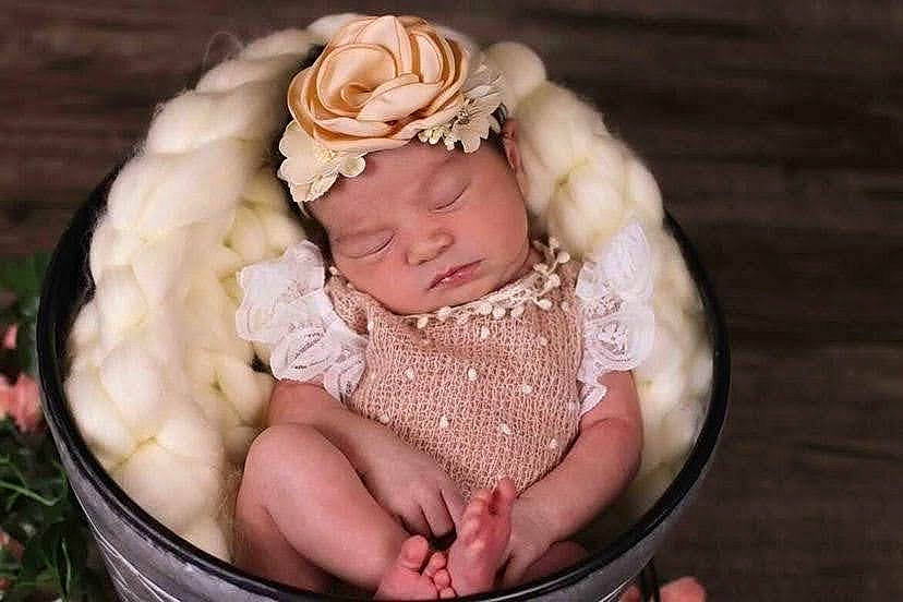 Avayah joined the competition — help win amazing prizes! baby, baby_products, baby_sleeping, baby_toddler_clothing, cheek, comfort, event, eye, face, head, headband, headpiece, headwear, nail, pattern, person, petal, pink, sitting, skin