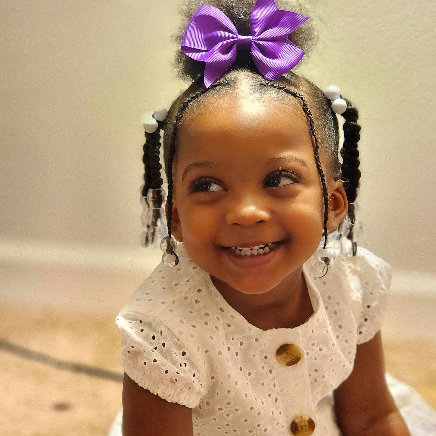 Malayah is registered to the contest to win money with this photo: accessories, child, clothing, dress, earring, face, female, flower, formalwear, girl, happy, head, headband, jewelry, person, photography, plant, portrait, purple, smile
