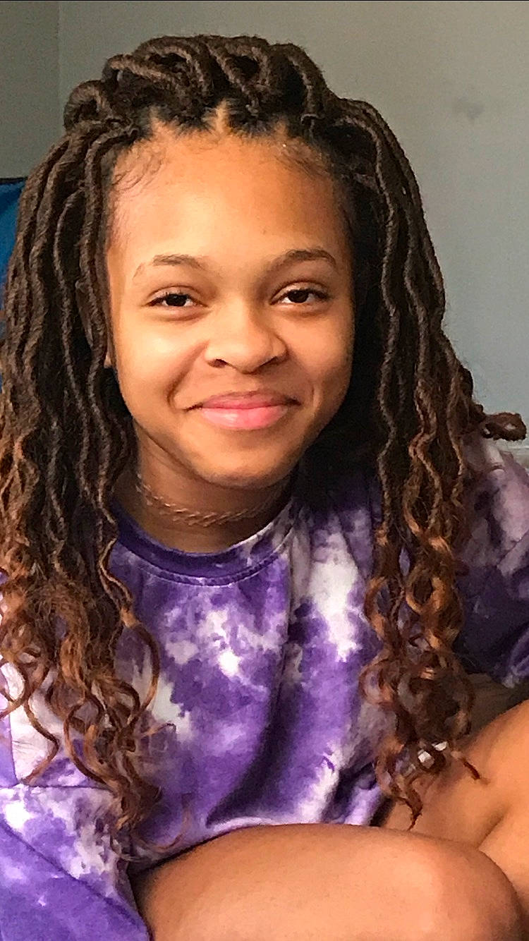 Jesselle is registered to the contest to win money with this photo: beauty, black_hair, cheek, chin, cool, dreadlocks, eyebrow, forehead, hair, hairstyle, happy, iris, joy, lavender, lip, long_hair, neck, person, purple, ringlet