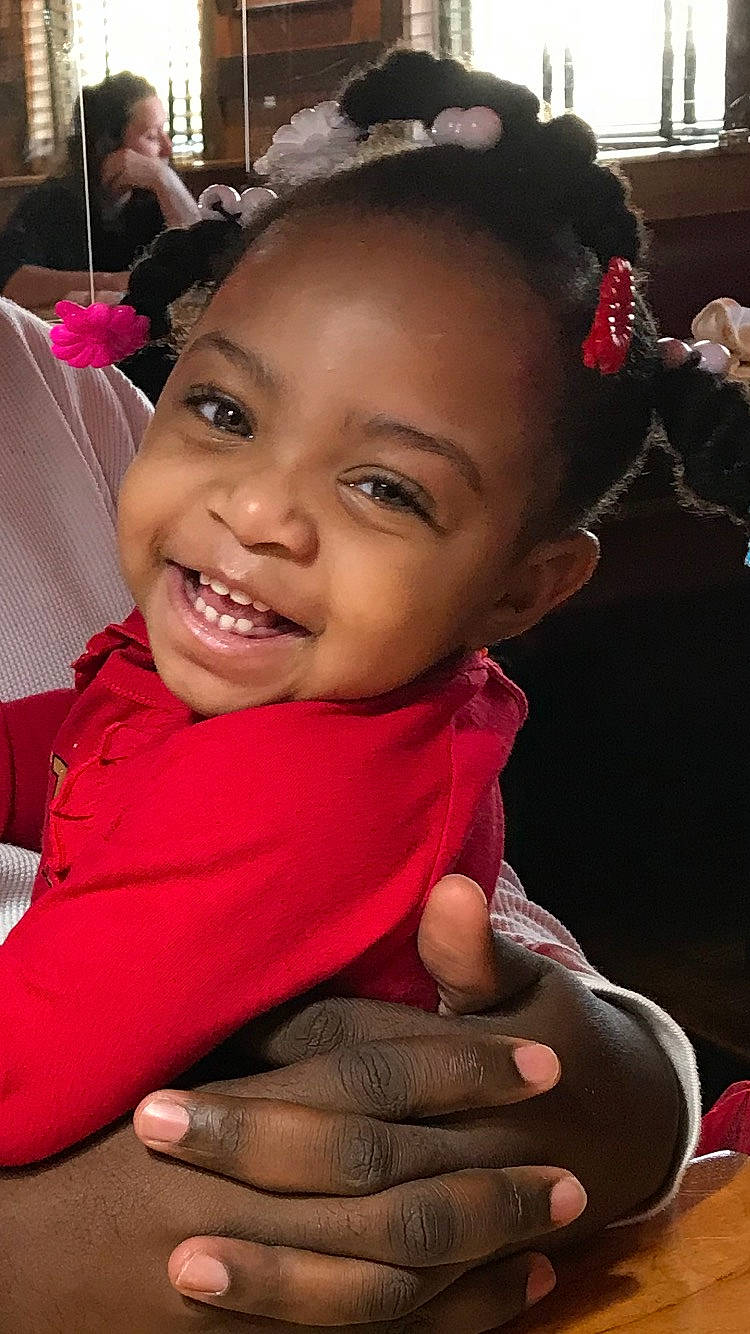 Jenevieve joined the competition — help win amazing prizes! baby_toddler_clothing, black_hair, cheek, chin, eyebrow, eyelash, finger, forehead, gesture, hair_accessory, hairstyle, happy, joy, lip, nail, nose, organ, person, skin, temple