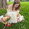 woman, dog, grass, tree, bouquet, flower, dress, outdoor, pet, small_dog, nature, greenery, leaves, park, cute, smile, redhead, animal, wedding, happy