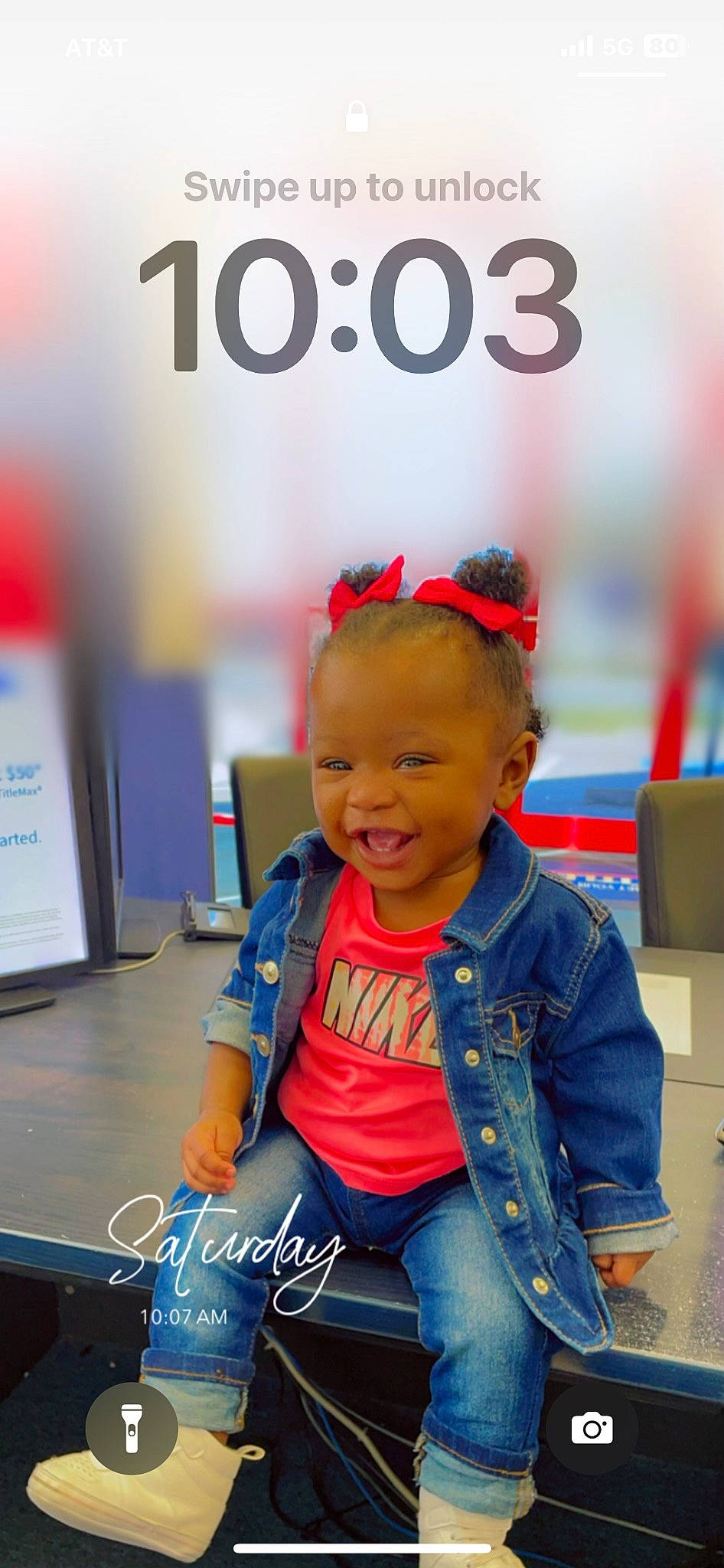 Leah is registered to the contest to win money with this photo: baby, baby_toddler_clothing, child, denim, electric_blue, fashion_accessory, flooring, fun, happy, joy, leisure, logo, person, personal_protective_equipment, play, recreation, room, sitting, smile, standing