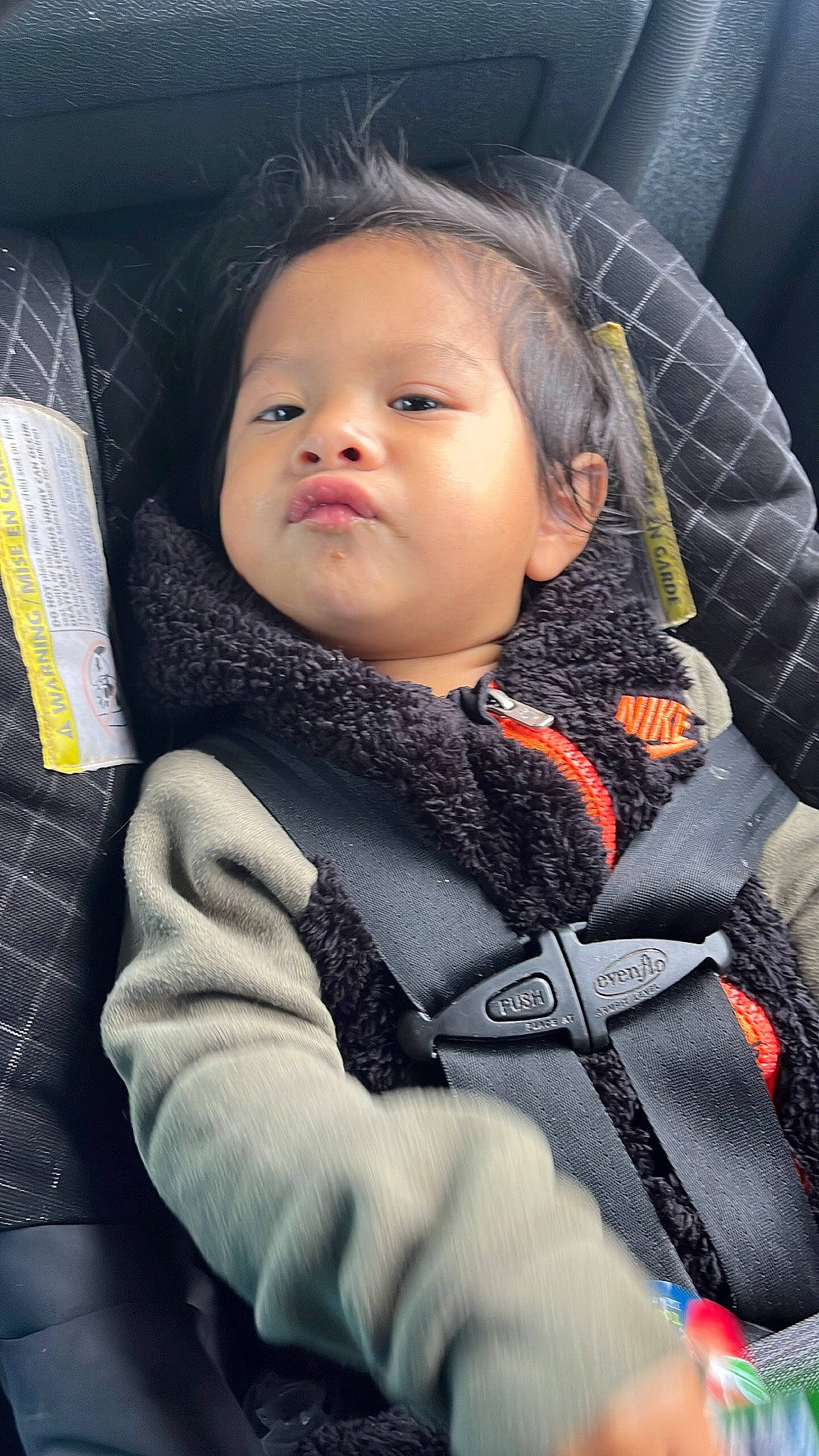 Matteo is registered to the contest to win money with this photo: baby, baby_carriage, baby_products, baby_toddler_clothing, cheek, child, comfort, cool, facial_expression, finger, flash_photography, happy, jacket, lip, nose, person, sitting, skin, sleeve, toddler