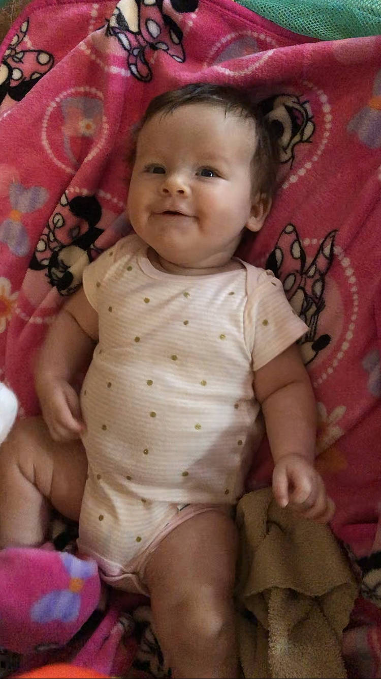 Jenna is registered to the contest to win money with this photo: baby, baby_toddler_clothing, cheek, chin, eye, eyebrow, head, human, iris, joy, lip, mouth, organ, person, pink, skin, sleeve, smile, stomach, textile