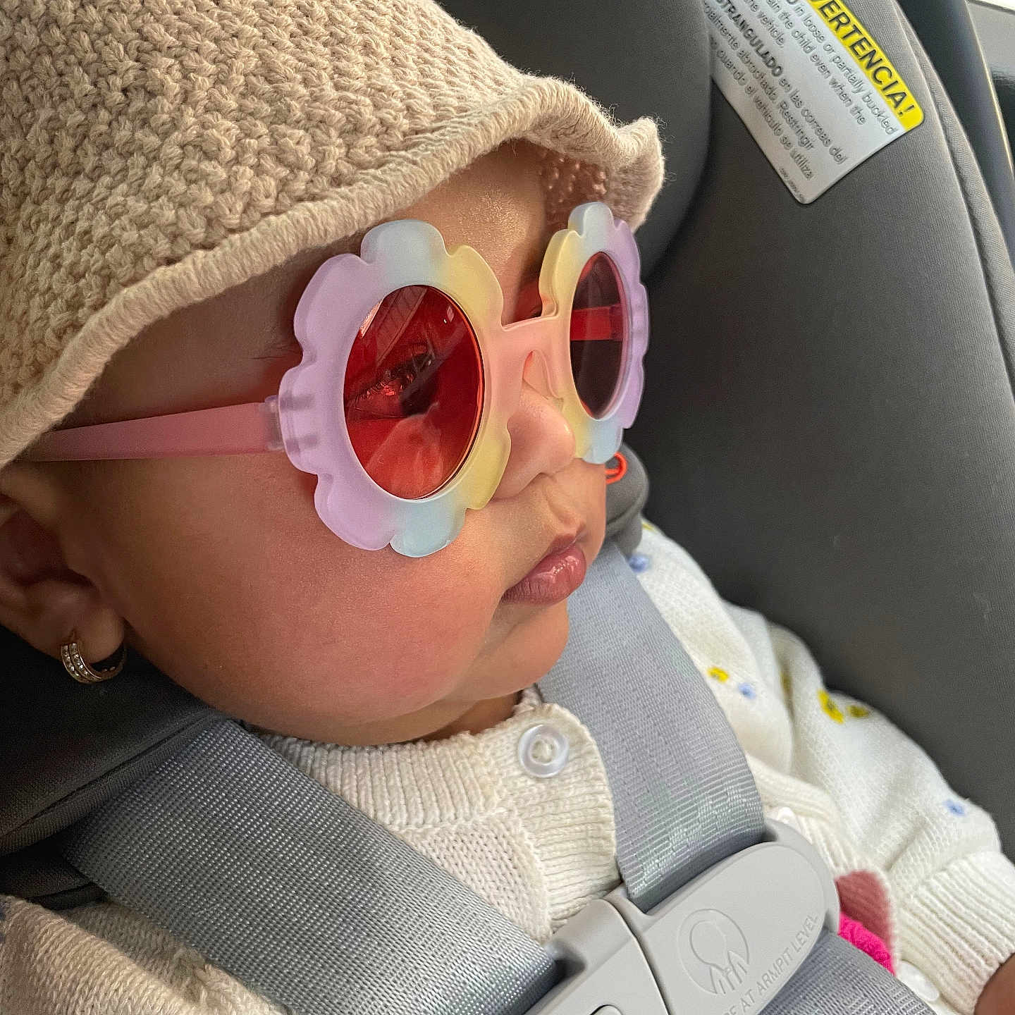 Hannah is registered to the contest to win money with this photo: accessories, baby, belt, bonnet, cap, car, car_interior, carseat, clothing, cushion, face, glasses, hat, head, homedecor, person, photography, portrait, sunglasses, transportation