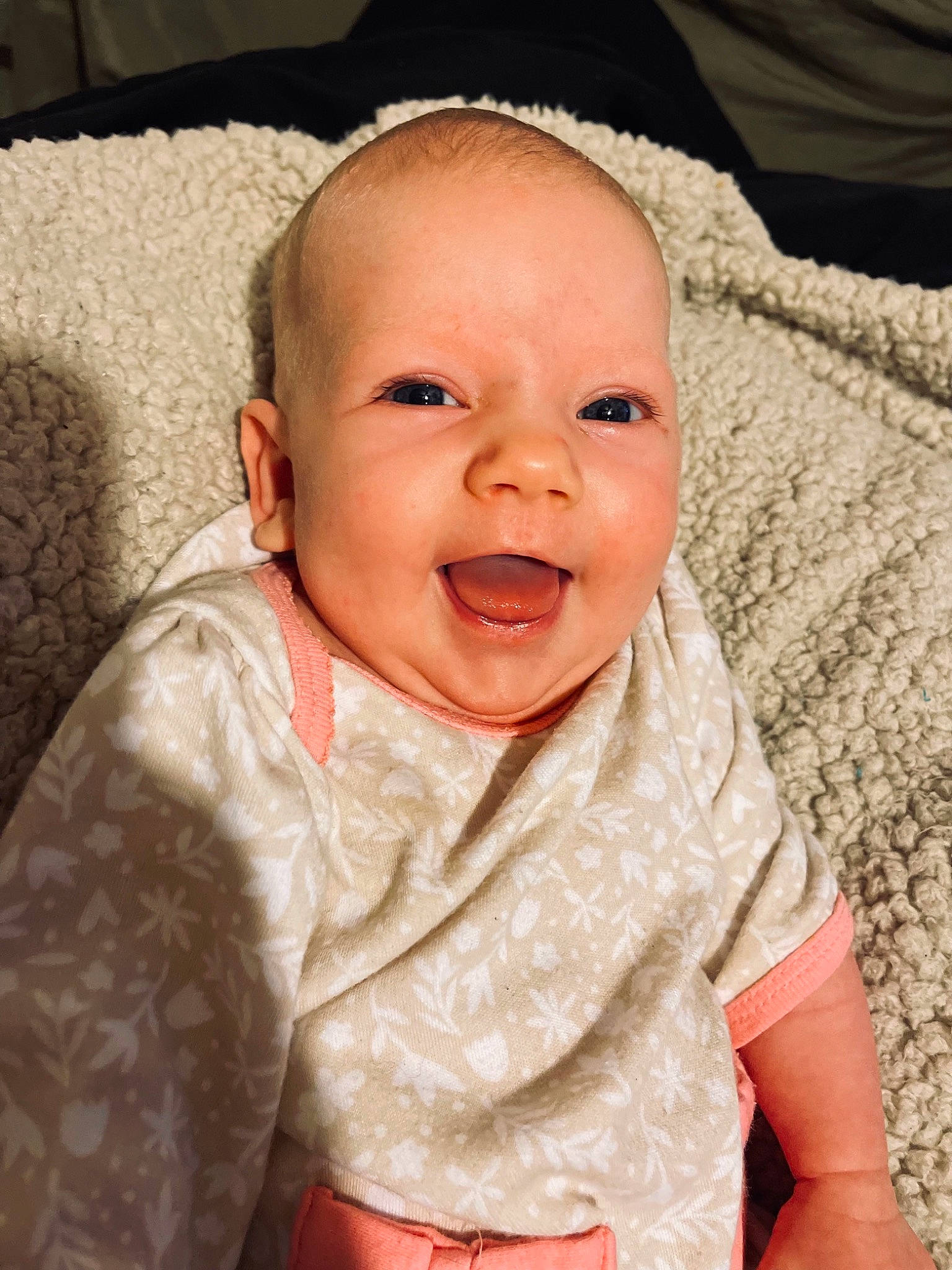 Anessa is registered to the contest to win money with this photo: baby, baby_toddler_clothing, cheek, child, collar, comfort, eye, gesture, happy, head, iris, linens, lip, mouth, nose, person, skin, sleeve, smile, textile