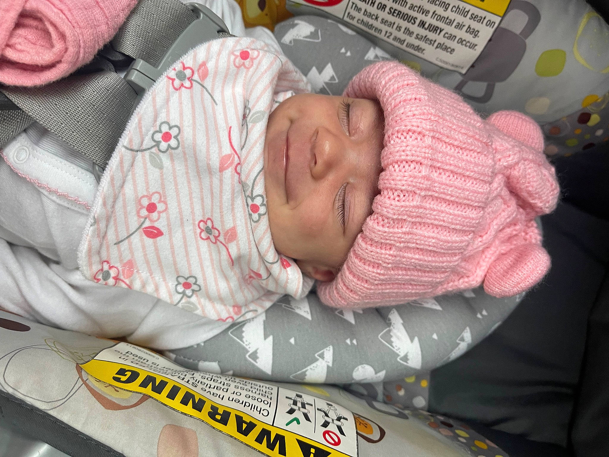 Brynna is registered to the contest to win money with this photo: baby, baby_products, baby_sleeping, baby_toddler_clothing, bedtime, carmine, child, comfort, hat, headwear, linens, mouth, nap, pattern, person, pink, room, sleep, sleeve, textile