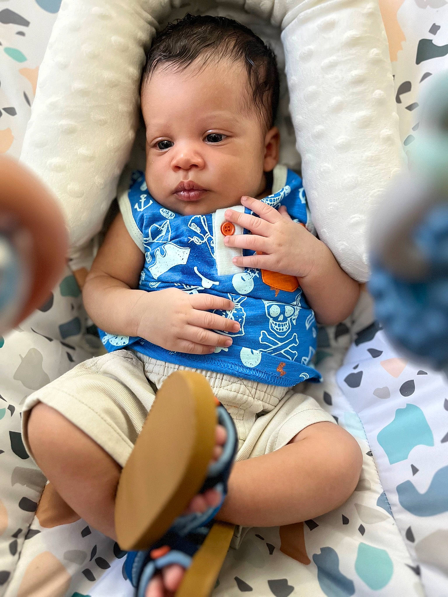Luis is registered to the contest to win money with this photo: arm, baby, baby_toddler_clothing, cheek, child, comfort, eye, finger, fun, hairstyle, happy, human_leg, knee, nail, person, shorts, sitting, skin, thigh, toddler