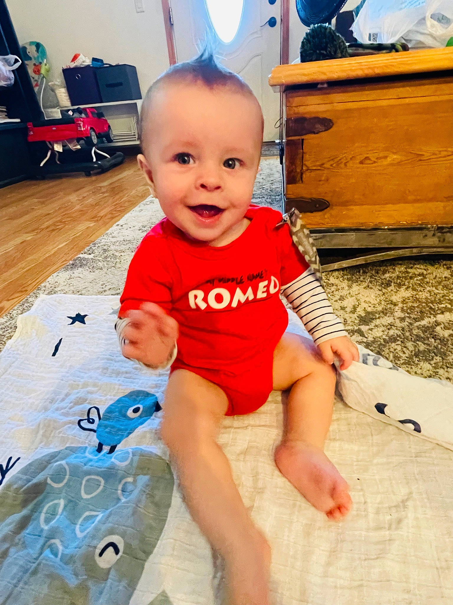 Konnan joined the competition — help win amazing prizes! baby, baby_toddler_clothing, blue, child, facial_expression, finger, floor, flooring, fun, happy, head, joy, leg, leisure, person, skin, sleeve, smile, t_shirt, thigh