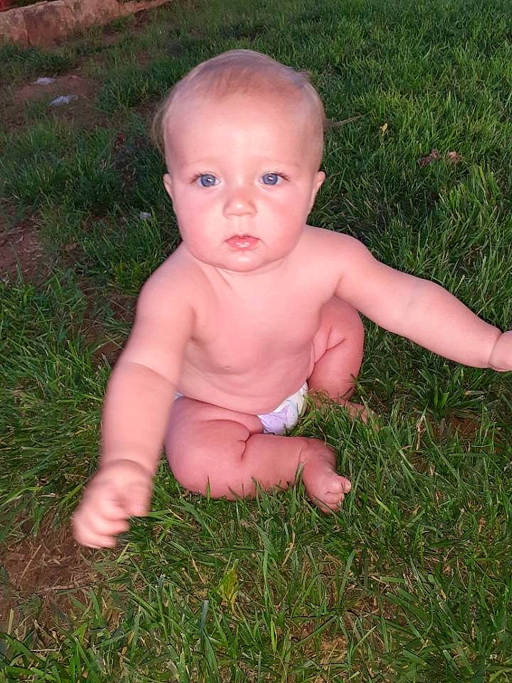 Turner joined the competition — help win amazing prizes! baby, child, face, finger, grass, grass_family, head, leg, meadow, muscle, person, plant, sitting, skin, thumb, toddler, trunk