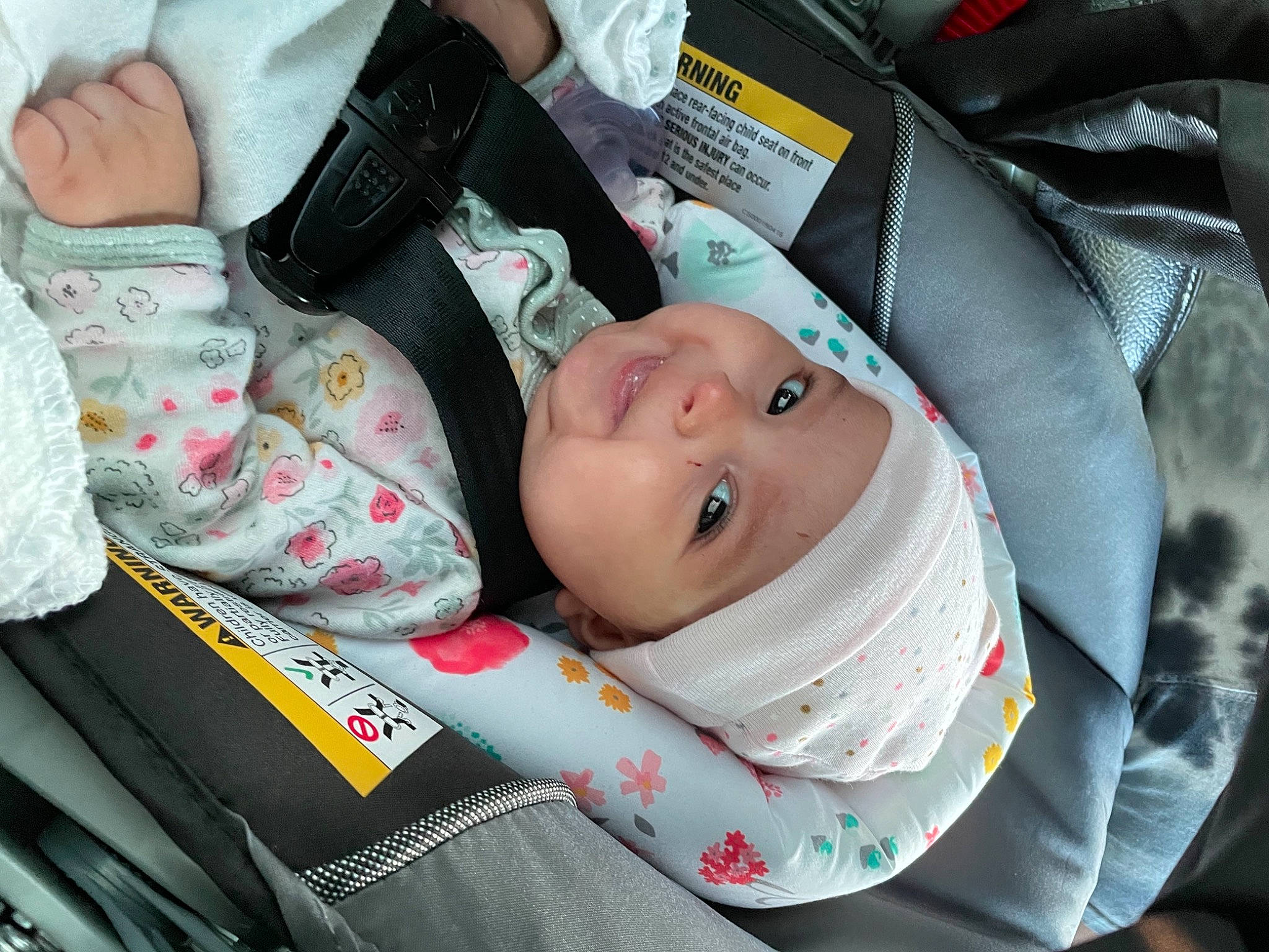 April Clementine is registered to the contest to win money with this photo: auto_part, baby, baby_carriage, baby_in_car_seat, baby_products, baby_safety, baby_toddler_clothing, car_seat, carmine, cheek, child, comfort, happy, headwear, nail, nap, person, sitting, sleep, smile