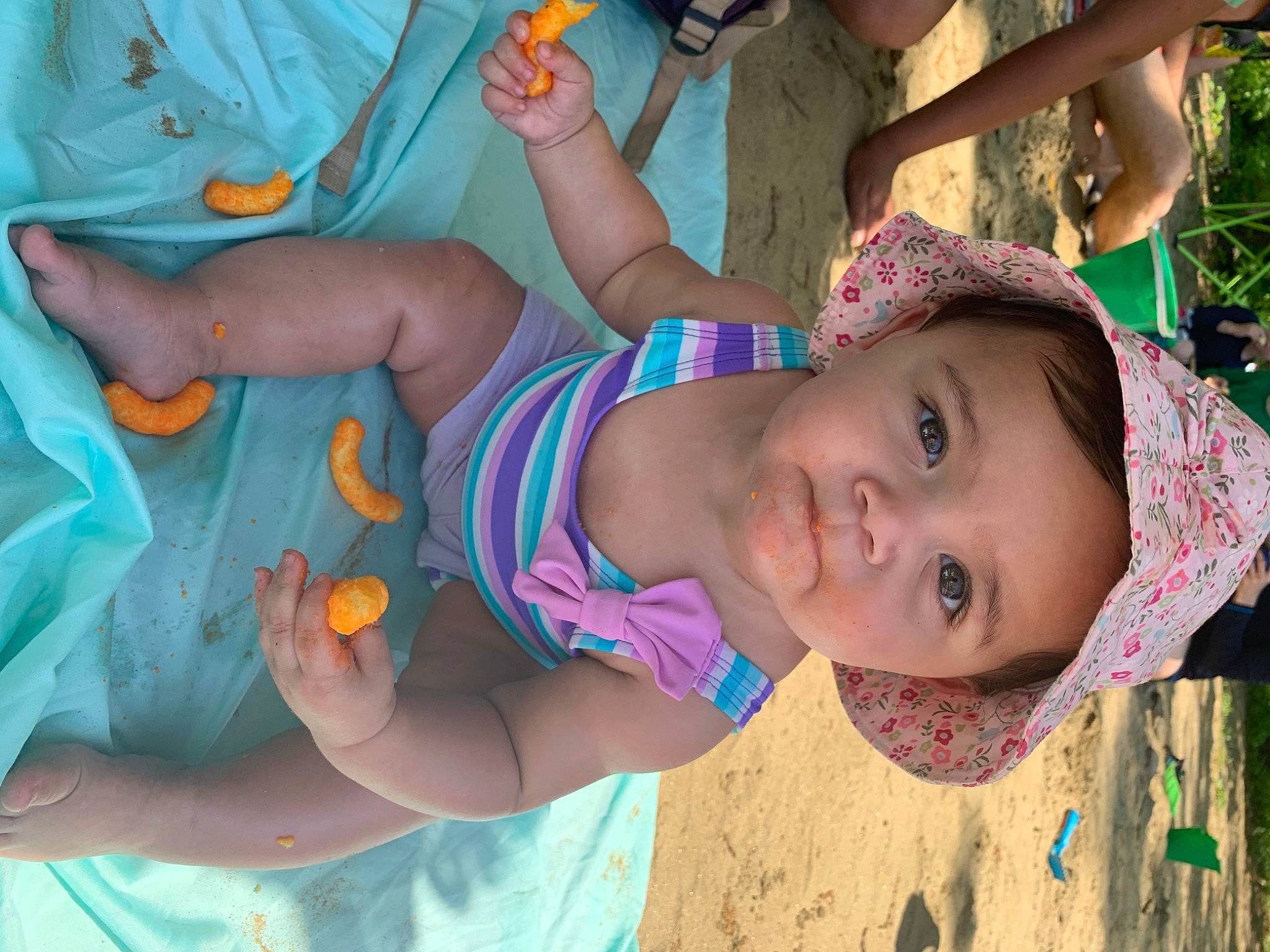 Jescira is registered to the contest to win money with this photo: arm, baby, dress, eye, face, facial_expression, green, hand, happy, head, headwear, human_body, leaf, leisure, mouth, person, pink, product, skin, textile