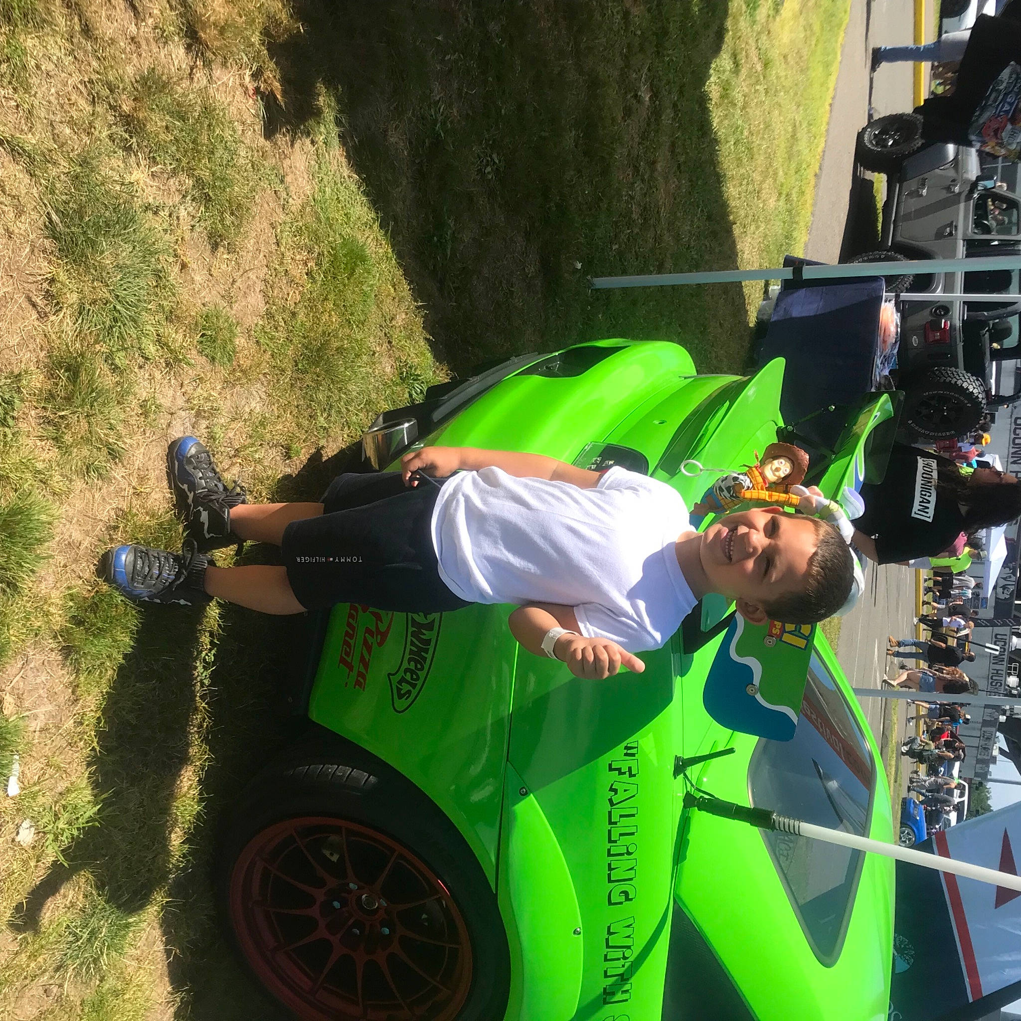 Adonis joined the competition — help win amazing prizes! auto_part, automotive_design, automotive_exterior, automotive_lighting, automotive_tire, automotive_wheel_system, bumper, fender, fun, grass, helmet, hood, joy, lawn, motor_vehicle, person, recreation, rim, tire, vehicle