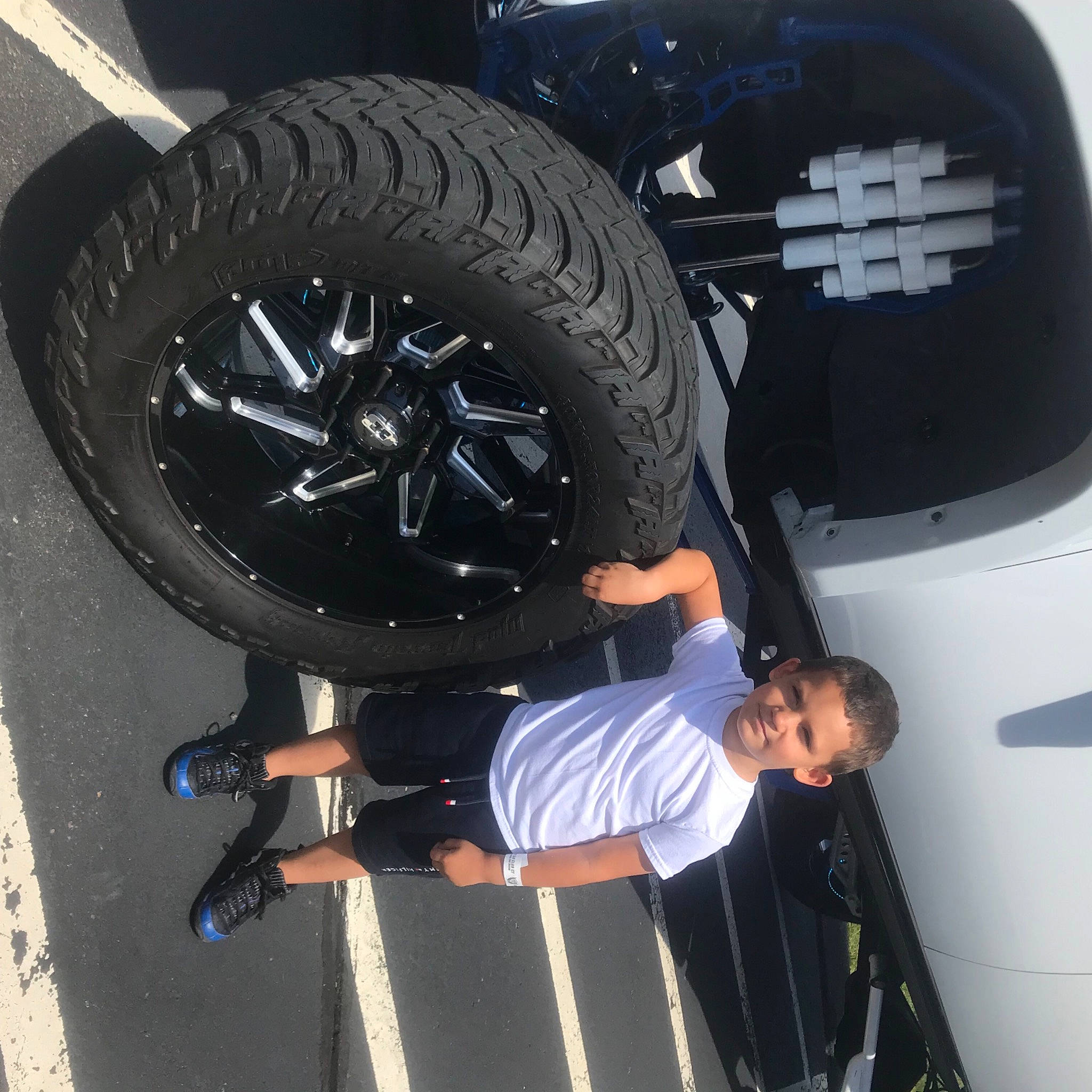 Adonis joined the competition — help win amazing prizes! alloy_wheel, automotive_design, automotive_exterior, automotive_lighting, automotive_tire, bumper, car, fender, hood, hubcap, joy, light, motor_vehicle, person, rim, rolling, synthetic_rubber, tire, tread, vehicle