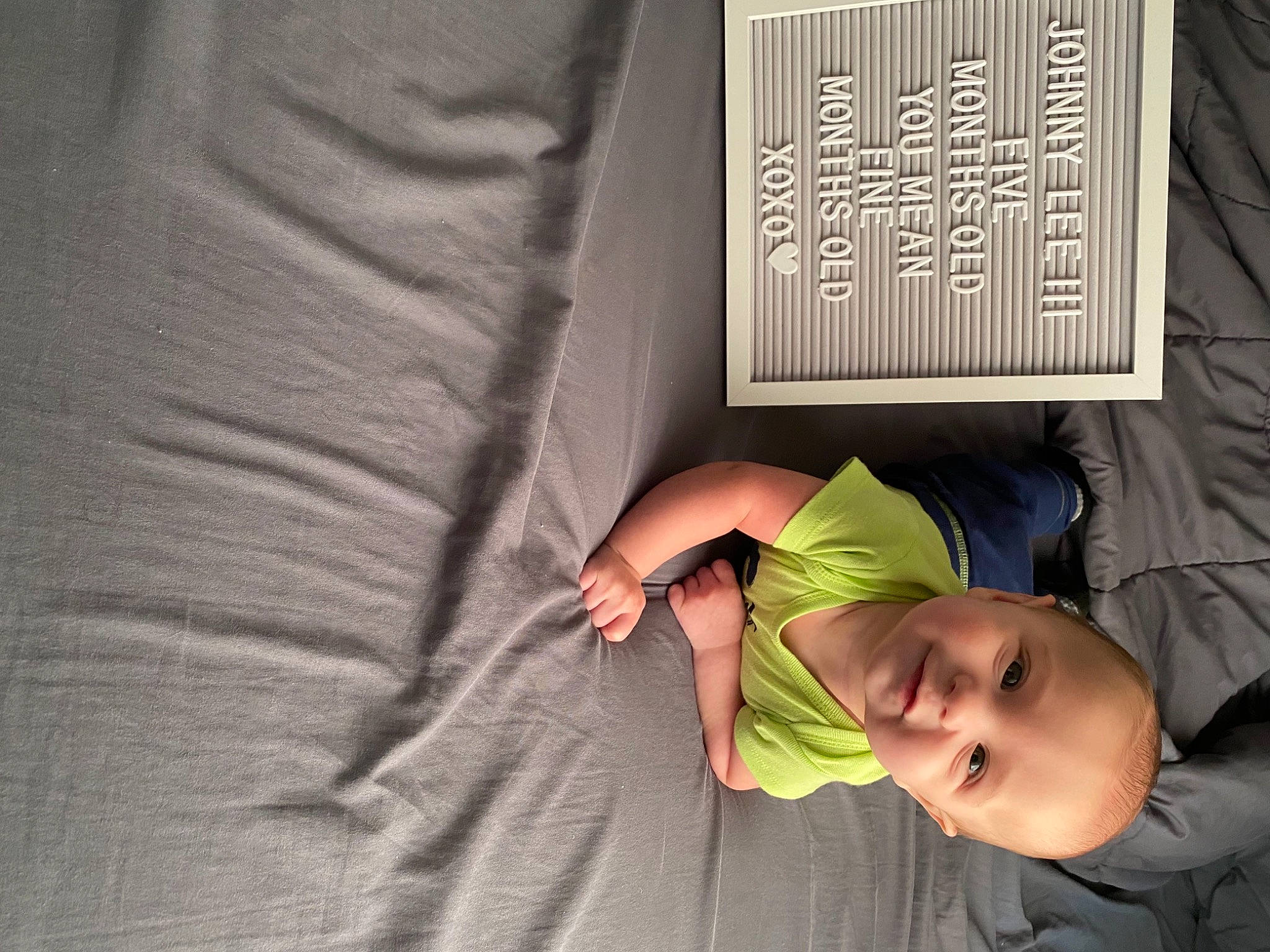 Johnny joined the competition — help win amazing prizes! baby, baby_products, baby_toddler_clothing, bedding, bedtime, child, comfort, finger, flooring, gesture, hand, linens, nap, person, room, sitting, sleeve, t_shirt, thumb, toddler