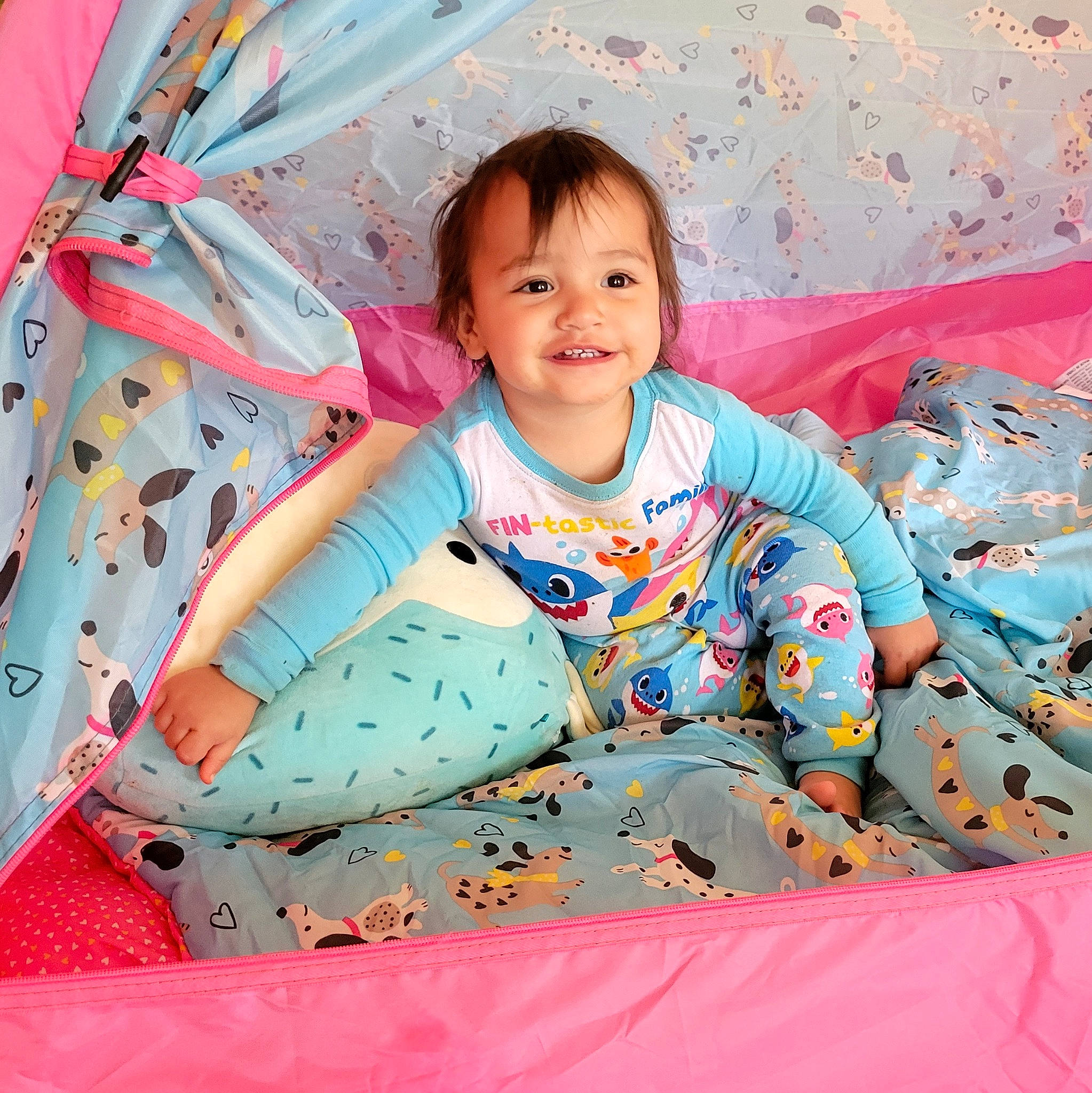 Clarissa is registered to the contest to win money with this photo: baby, baby_products, baby_toddler_clothing, child, comfort, face, facial_expression, fun, happy, joy, leisure, linens, pattern, person, pink, play, sitting, sleeve, smile, t_shirt