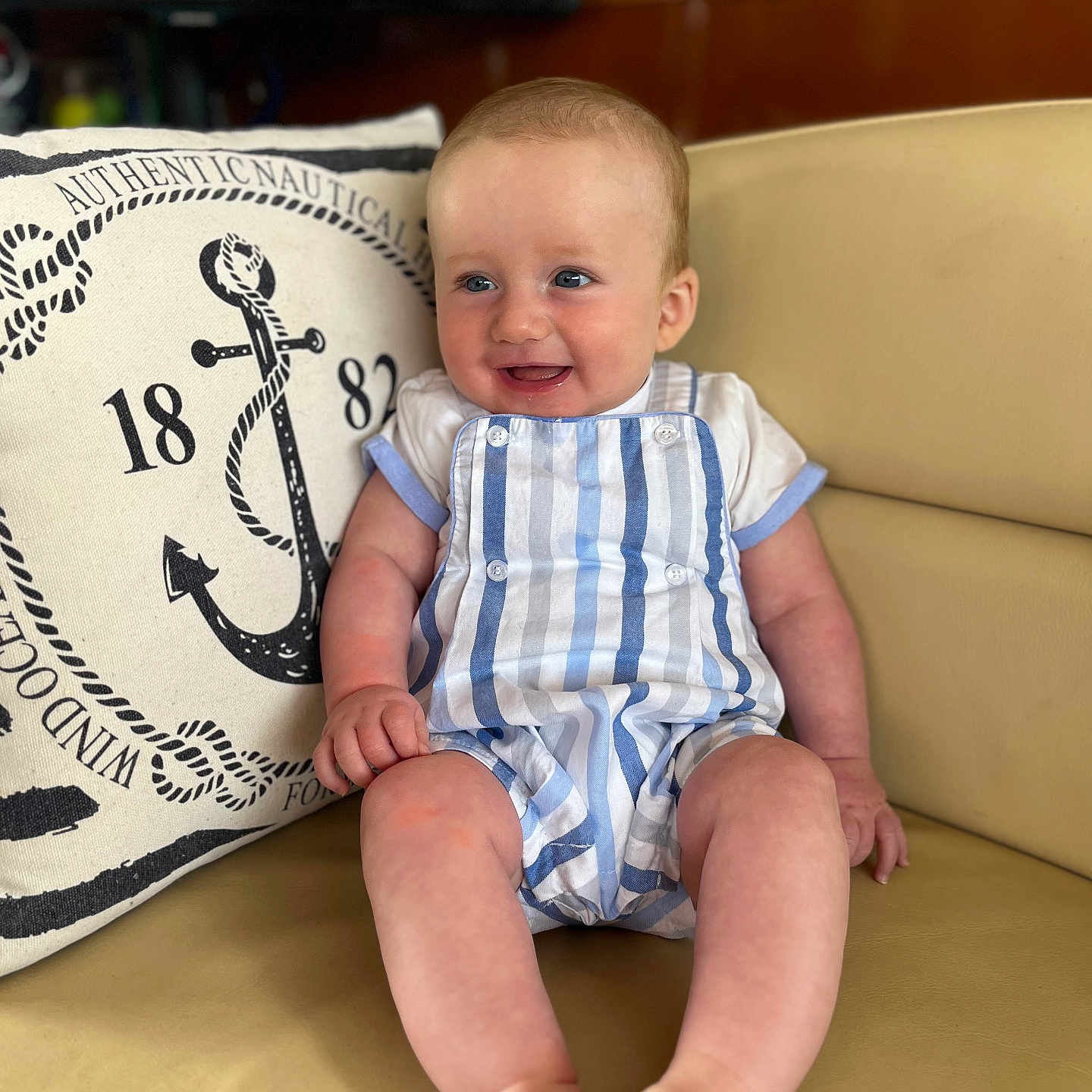 Austin is registered to the contest to win money with this photo: baby, clothing, computerhardware, couch, cushion, electronics, face, furniture, hardware, head, homedecor, monitor, pants, person, photography, pillow, portrait, screen, sitting, tv