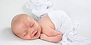 Giorgio is registered to the contest to win money with this photo: baby, newborn, smile, sleeping, white_cloth, blanket, skin, infant, peaceful, lying_down, cute, soft_light, portrait, human, child, resting, indoors, tender, fresh, serene
