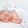 baby, newborn, smile, sleeping, white_cloth, blanket, skin, infant, peaceful, lying_down, cute, soft_light, portrait, human, child, resting, indoors, tender, fresh, serene