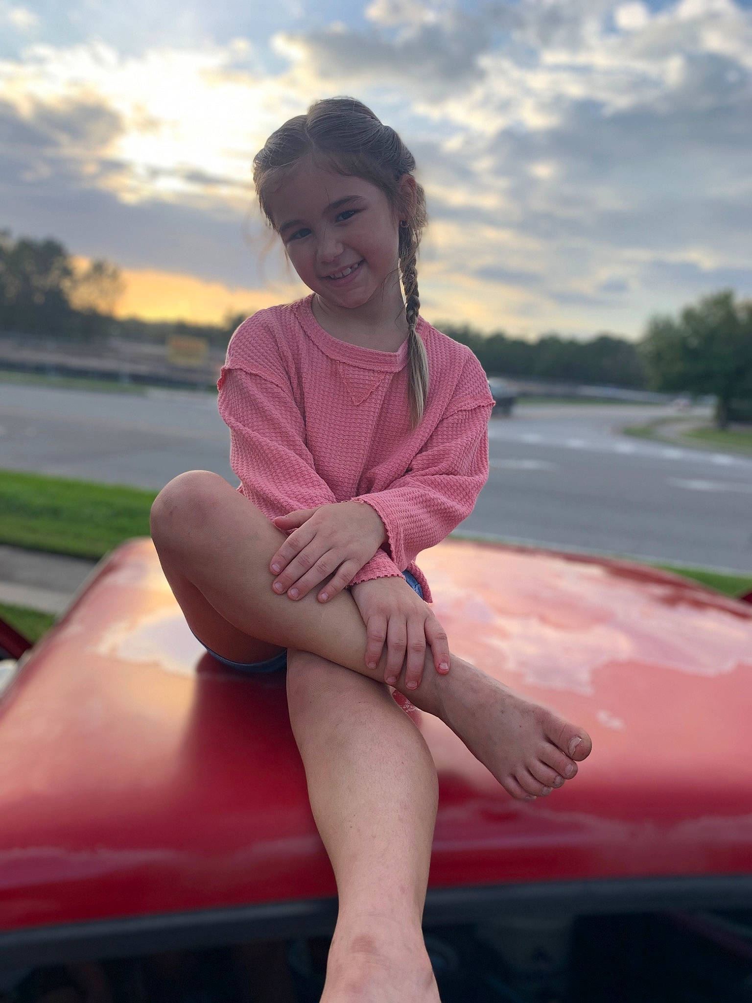 Bristol Lynn is registered to the contest to win money with this photo: automotive_design, automotive_exterior, automotive_lighting, cloud, face, flash_photography, fun, happy, hood, joy, leg, leisure, motor_vehicle, person, pink, shorts, skin, sky, smile, thigh