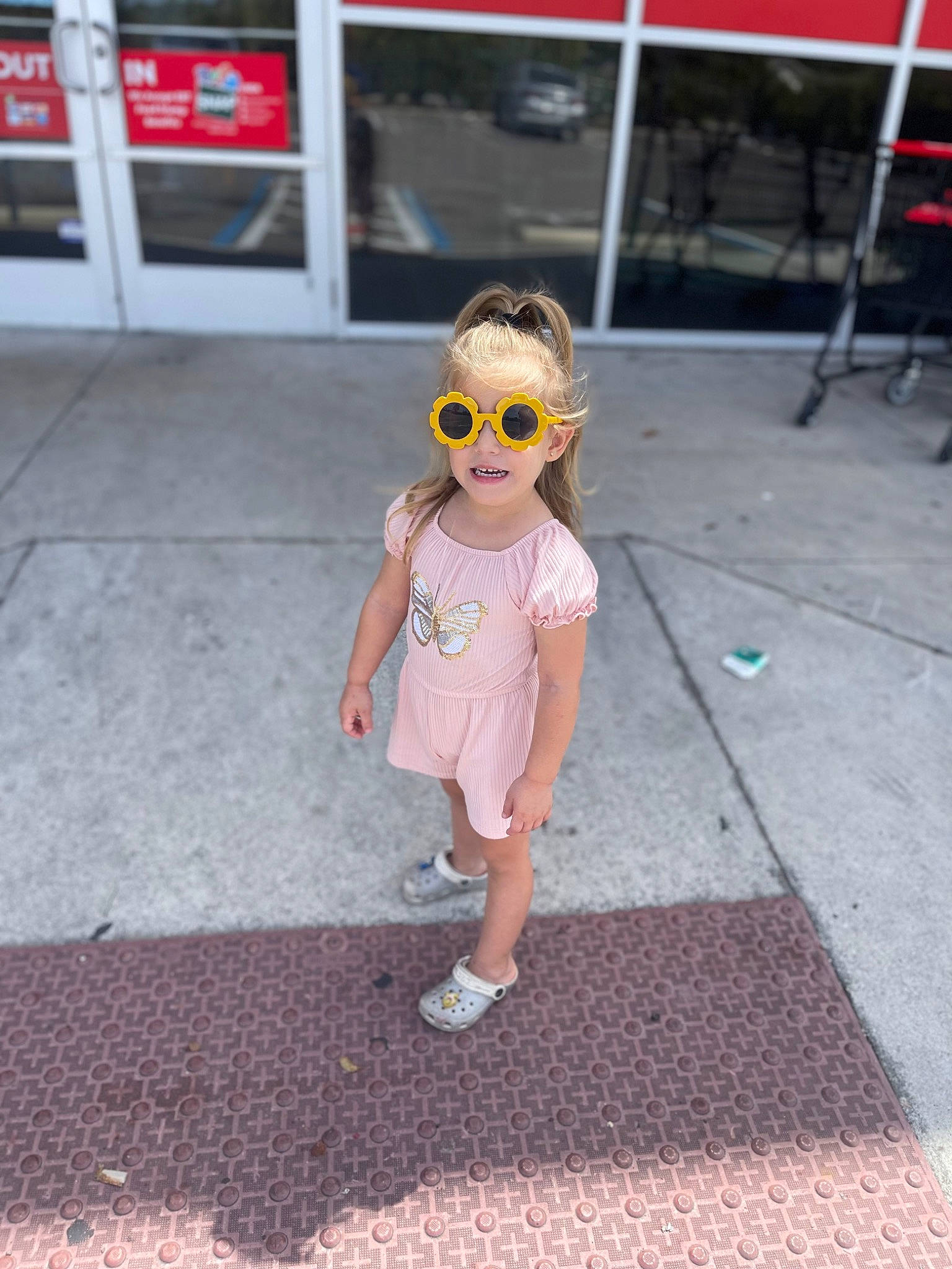 Georgia joined the competition — help win amazing prizes! asphalt, child, eyewear, fun, human_leg, magenta, pattern, person, public_space, recreation, road, road_surface, shorts, sidewalk, sleeve, smile, sunglasses, t_shirt, toddler, vision_care