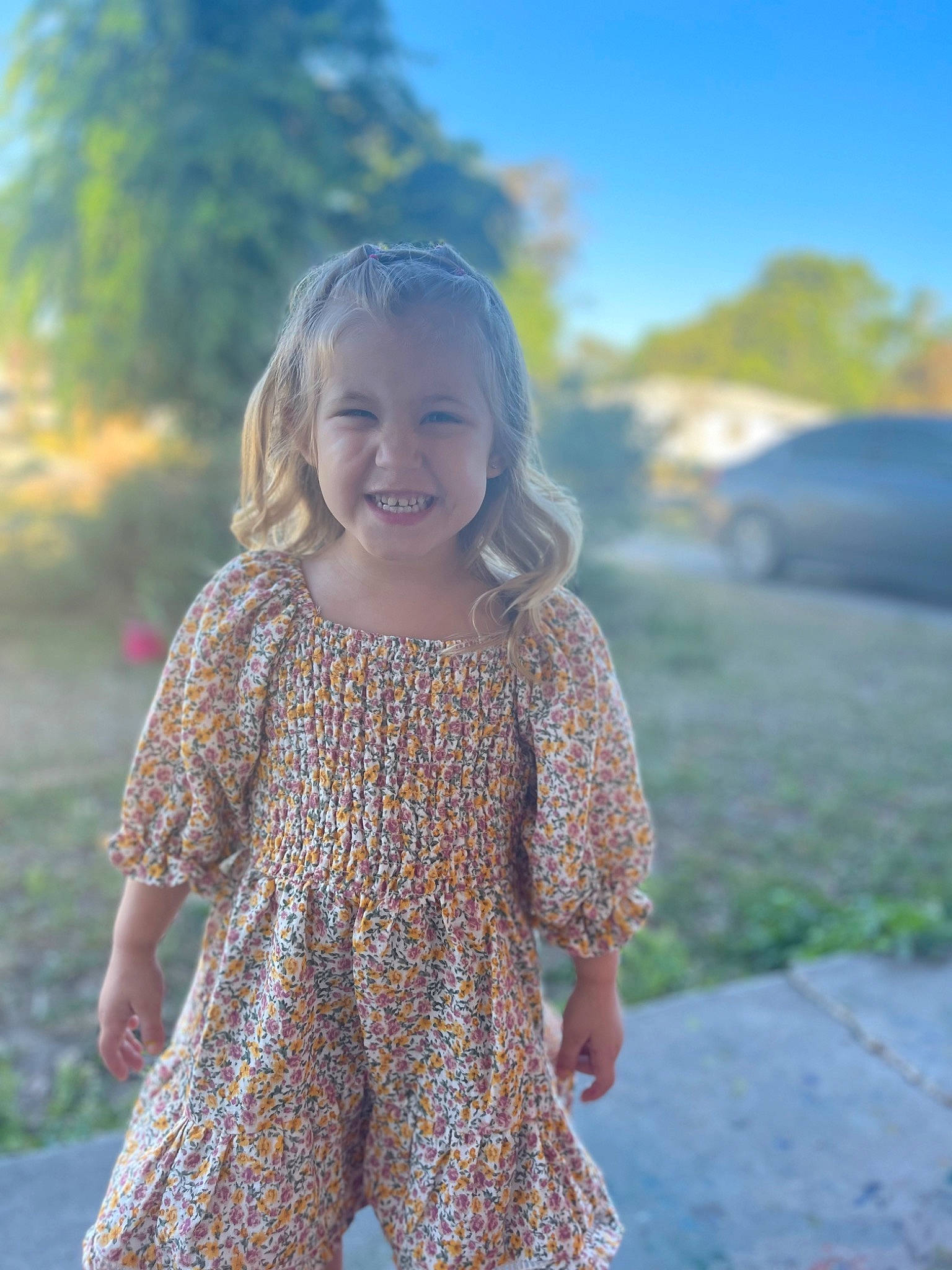 Georgia is registered to the contest to win money with this photo: blond, dress, eye, face, fawn, fun, grass, hair, hairstyle, happy, head, joy, leisure, long_hair, people_in_nature, person, plant, sky, smile, sunlight