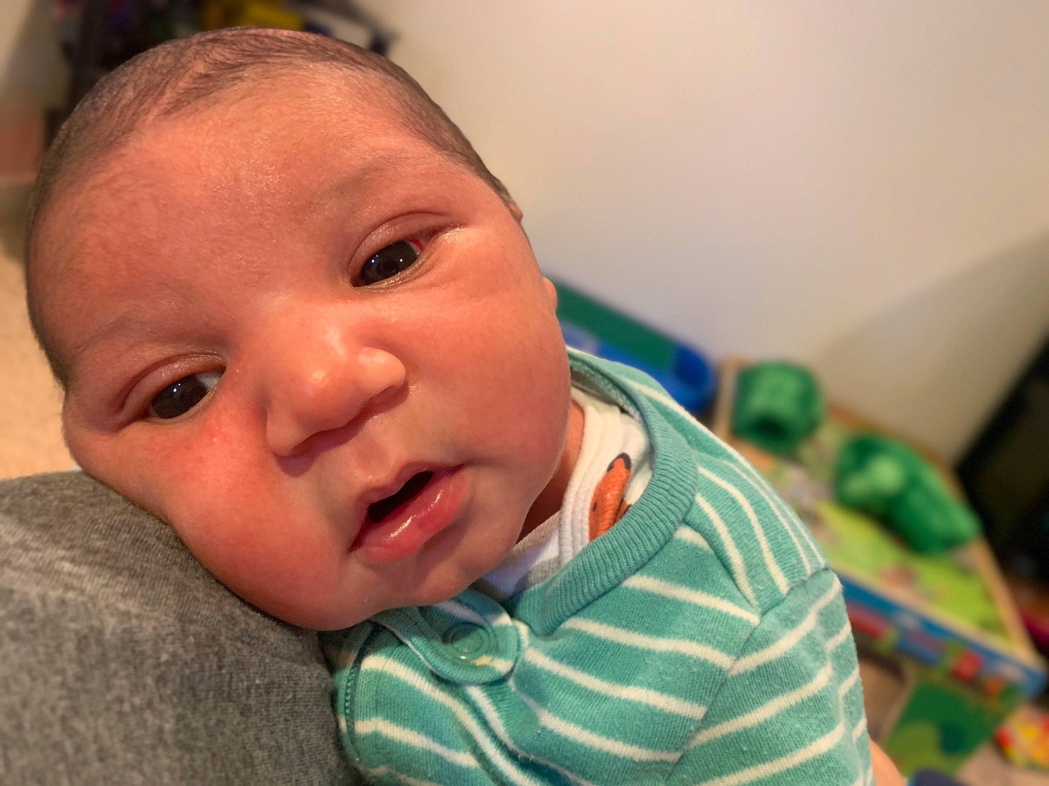 Dallas is registered to the contest to win money with this photo: baby, baby_toddler_clothing, cheek, chin, ear, eyebrow, eyelash, finger, gesture, happy, iris, lip, mouth, neck, nose, person, skin, sleeve, smile, thumb